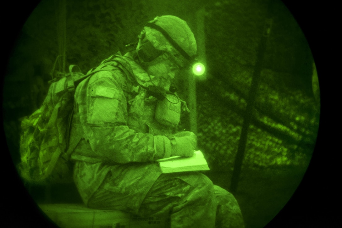 As seen through a night-vision device, an Army paratrooper notes measurements at night during Exercise Rock Sokol at Pocek Range in Postojna, Slovenia, March 10, 2016. The training exercise between U.S. and Slovenian troops focuses on enhancing readiness between allied forces. The paratrooper is assigned to 2nd Battalion, 503rd Infantry Regiment, 173rd Airborne Brigade. Army photo by Davide Dalla Massara