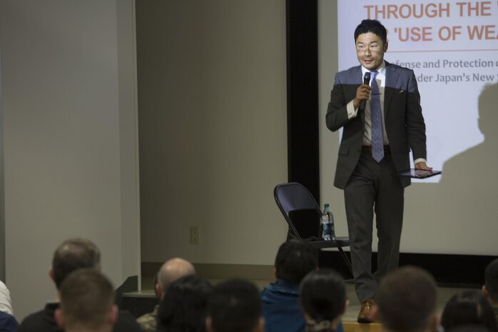Masahiro Kurosaki, professor at the Japan National Defense Academy, leads a discussion during the Legislation for Peace and Security seminar at Marine Corps Air Station Iwakuni, Japan, March 11, 2016. Recent changes in national policy gives Japan the capability to take a more proactive stance in matters that may threaten Japan, its citizens and its allies. (U.S. Marine Corps photo by Cpl. Nathan Wicks/Released)