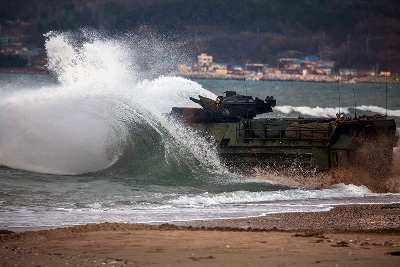 A U.S. Marine Corps Amphibious Assault Vehicle assigned to Battalion Landing Team 1st Battalion, 5th Marines, 31st Marine Expeditionary Unit enters the water after conducting an amphibious assault rehearsal during Exercise Ssang Yong 16, Dogu Beach, Pohang, Republic of Korea, Mar. 10, 2016. The U.S. Navy and Marine Corps team is committed to the ROK-U.S. Alliance and conduct exercises regularly to ensure interoperability and maintain strong working relationships to support the sovereignty of the ROK.  Ssang Yong familiarizes American armed forces with the Korean Peninsula and builds upon the strong preexisting relationship between the two militaries.  The Marines and sailors of the 31st MEU are currently deployed aboard the Bonhomme Richard Amphibious Ready Group as part of their spring deployment of the Asia-Pacific region. (U.S. Marine Corps Photo by GySgt Ismael Pena/Released)
