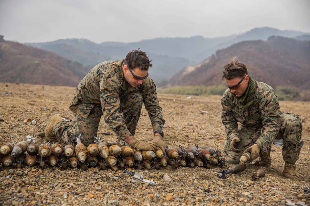 U.S. Marines Gunnery Sgt. Jordan Torcello and Staff Sgt. Zachary Rubemeyer, explosive ordnance disposal technicians with the 13th Marine Expeditionary Unit, lay undetonated ordnance for a controlled detonation during Exercise Ssang Yong 16 on Suseongri live-fire range, Pohang, South Korea, March 13, 2016. Ssang Yong is a biennial combined amphibious exercise conducted by U.S. forces with the Republic of Korea Navy and Marine Corps, Australian Army and Royal New Zealand Army Forces in order to strengthen interoperability and working relationships across a wide range of military operations.