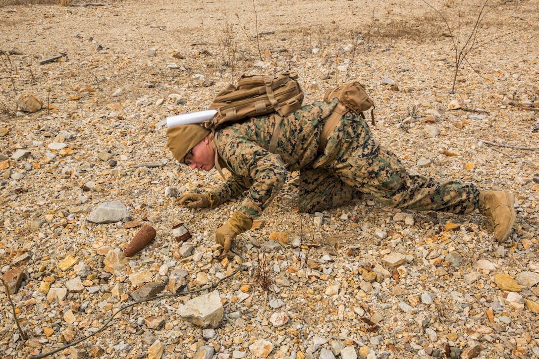 U.S. Marine Staff Sgt. Shaun Reuter, an explosive ordnance disposal technician with the 13th Marine Expeditionary Unit, inspects pieces of an 81 mm round to make sure it doesn’t have any explosives left in it during Exercise Ssang Yong 16 on Suseongri live-fire range, Pohang, South Korea, March 13, 2016. Ssang Yong is a biennial combined amphibious exercise conducted by U.S. forces with the Republic of Korea Navy and Marine Corps, Australian Army and Royal New Zealand Army Forces in order to strengthen interoperability and working relationships across a wide range of military operations.