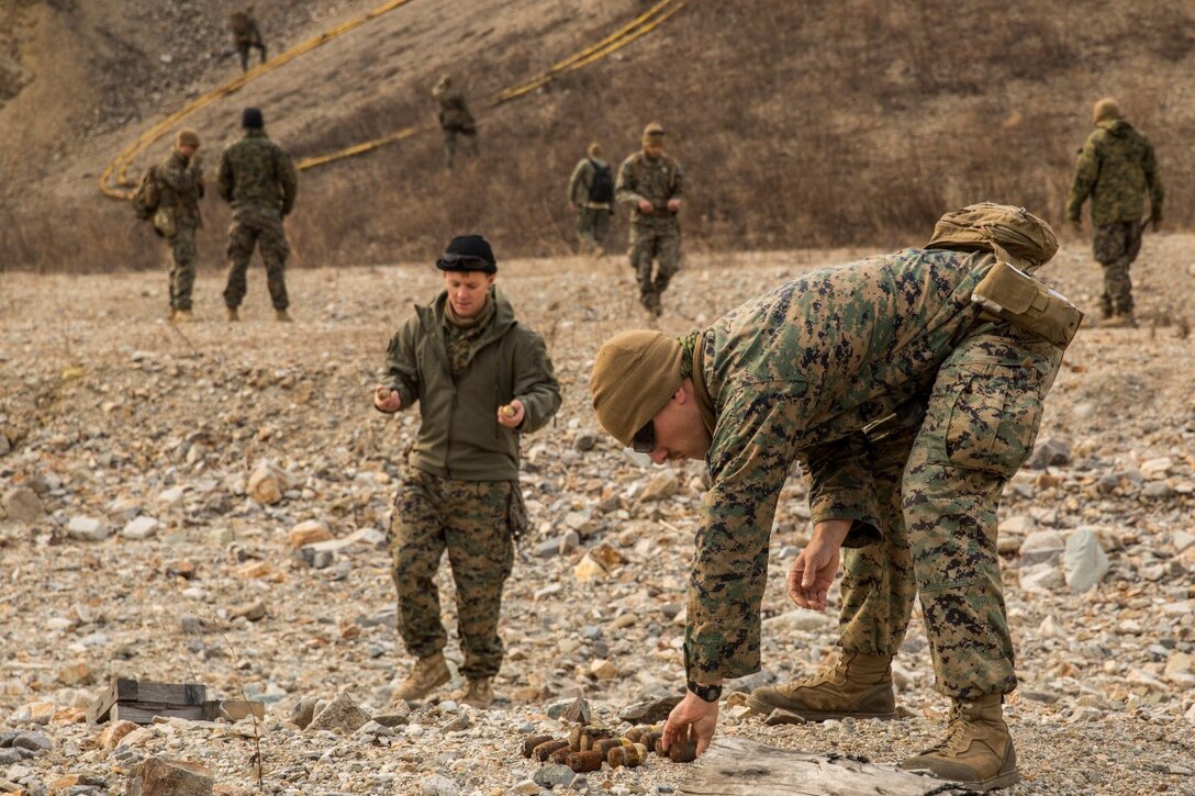 U.S. Marine explosive ordnance technicians with the 13th Marine Expeditionary Unit bring undetonated explosives for a controlled detonation during Exercise Ssang Yong 16 on Suseongri live-fire range, Pohang, South Korea, March 13, 2016. Ssang Yong is a biennial combined amphibious exercise conducted by U.S. forces with the Republic of Korea Navy and Marine Corps, Australian Army and Royal New Zealand Army Forces in order to strengthen interoperability and working relationships across a wide range of military operations.