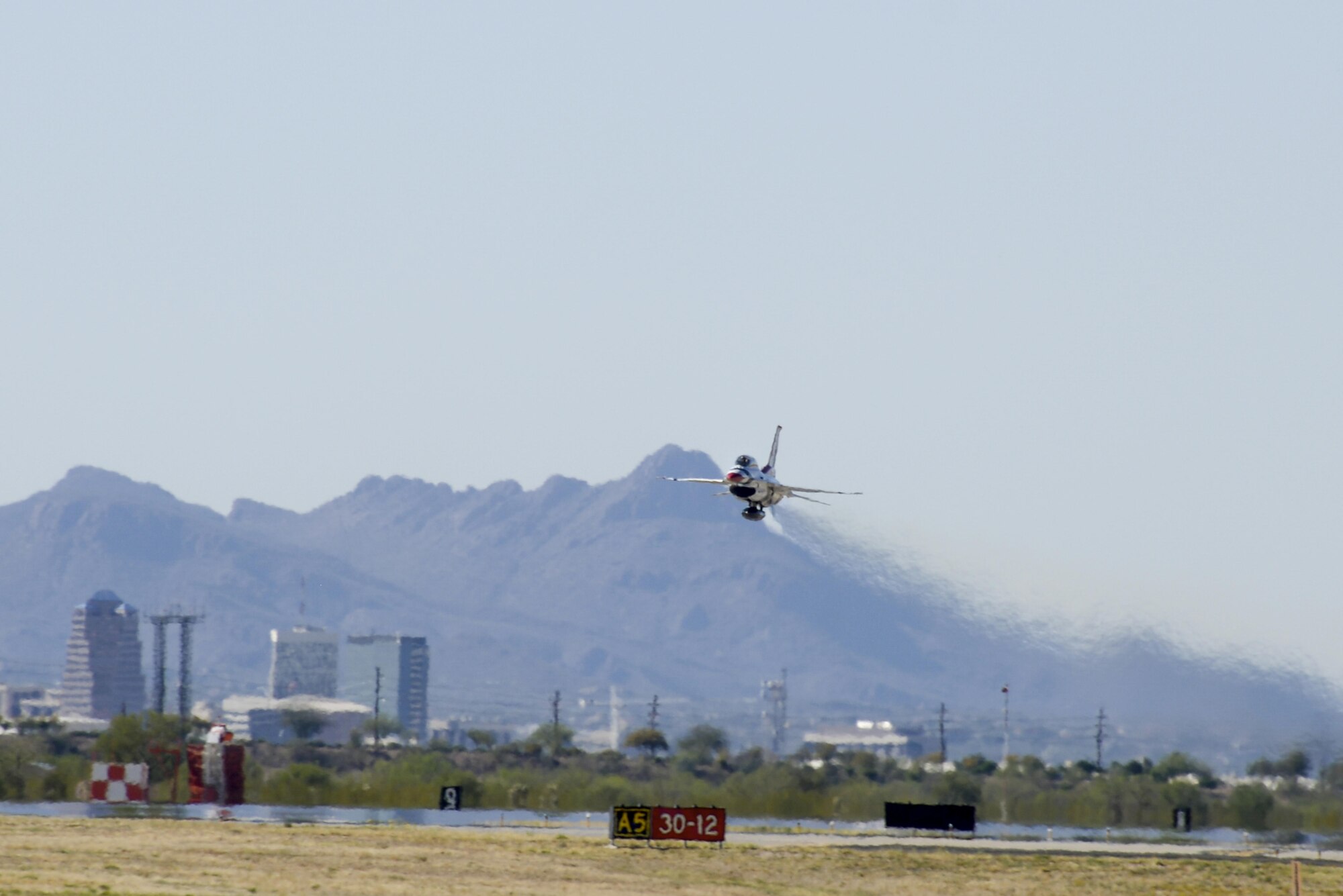 U.S. Air Force Maj. Kevin Walsh, U.S. Air Force Air Demonstration Squadron pilot and operations officer, launches Thunderbird 7, an F-16 Fighting Falcon, with Brendon Lyons, Tucson community hometown hero, in the rear seat at Davis-Monthan Air Force Base, Ariz., March 11, 2016.  Lyons was nominated as a hometown hero because of his commitment to safety and his passion to make Tucson a safer community for cyclists and motorists.  (U.S. Air Force photo by Senior Airman Chris Massey/Released)