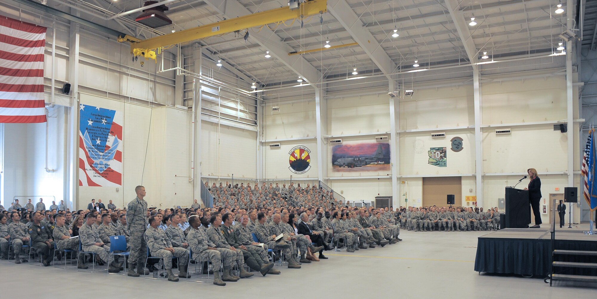 Secretary of the Air Force Deborah Lee James recognizes U.S. Air Force Tech Sgt. Michael Weis, 355th Equipment Maintenance Squadron, for his submission to the Airmen Powered by Innovation program, during an Airmen all call at Davis-Monthan Air Force Base, Ariz., March 9, 2016. Weis submitted a change to the A-10 Thunderbolt guidance that saves money and prevents maintainers from unintentionally damaging aircraft components for all A-10 units across all three components of active, guard and reserve. James spoke to the DLT Airmen about her priorities: taking care of people, balancing the readiness of today with modernization of tomorrow and making every dollar count. (U.S. Air Force photo by Airman 1st Class Mya M. Crosby/Released)