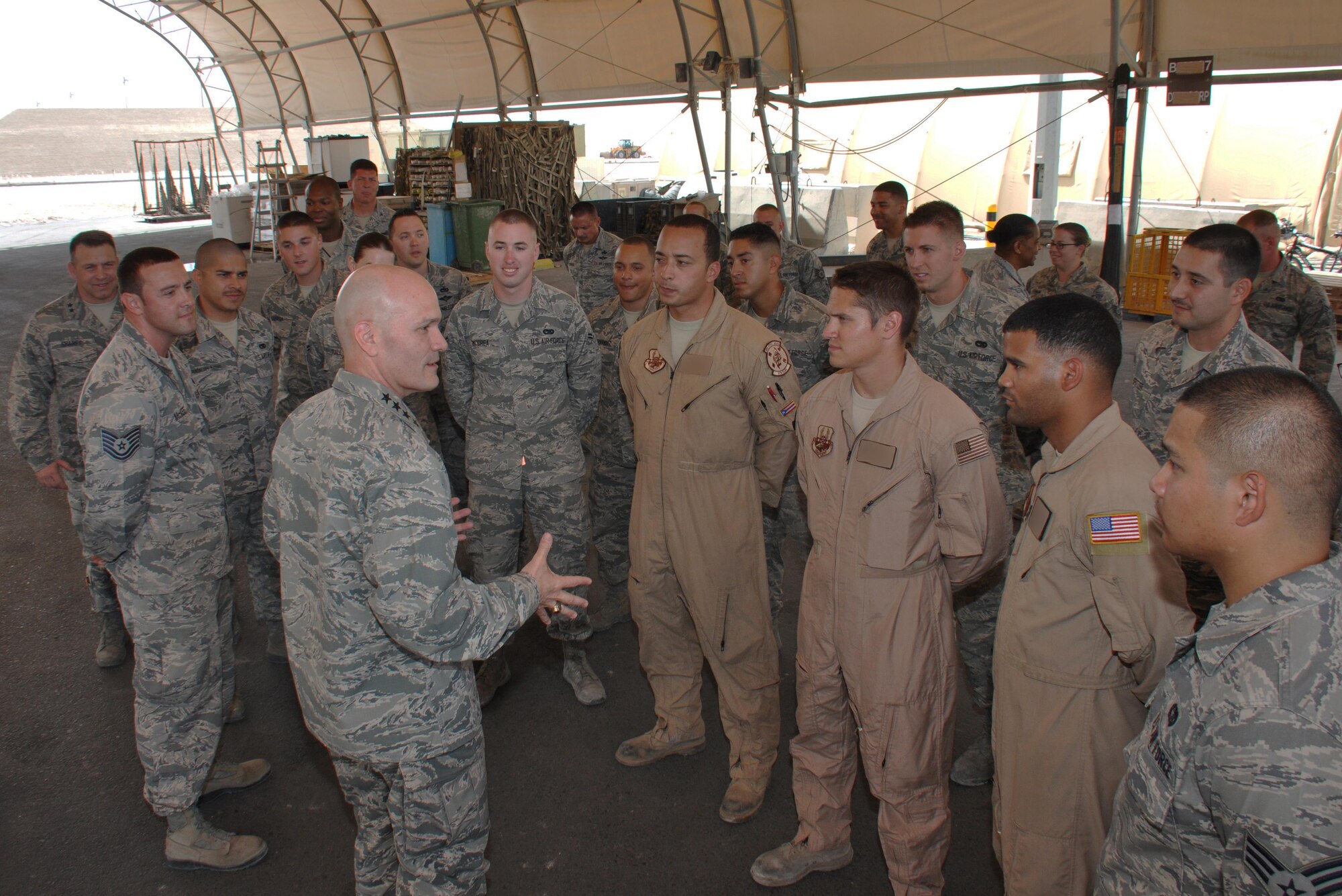 Gen. Carlton Everhart II, Air Mobility Command commander, meets with members of the 8th Expeditionary Air Mobility Squadron during a visit to Al Udeid Air Base, Qatar March 11. Everhart also held an all-call March 13 where he stressed the importance of maintaining readiness and modernizing mobility forces to face future challenges. Photo altered for security purposes. (U.S. Air Force photo by Tech. Sgt. James Hodgman)