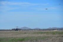 A three-ship formation of U.S. Air Force C-17 Globemaster III cargo aircraft prepare to land, March 4, 2016, on the flightline at Altus Air Force Base, Okla. Eight aircraft from Altus AFB met with four additional aircraft from Travis Air Force Base, Calif. and Joint Base Lewis-McChord, Wash. to realistically train U.S. Air Force aircrew members for future multi-base operations. (U.S. Air Force photo by Senior Airman Dillon Davis)
