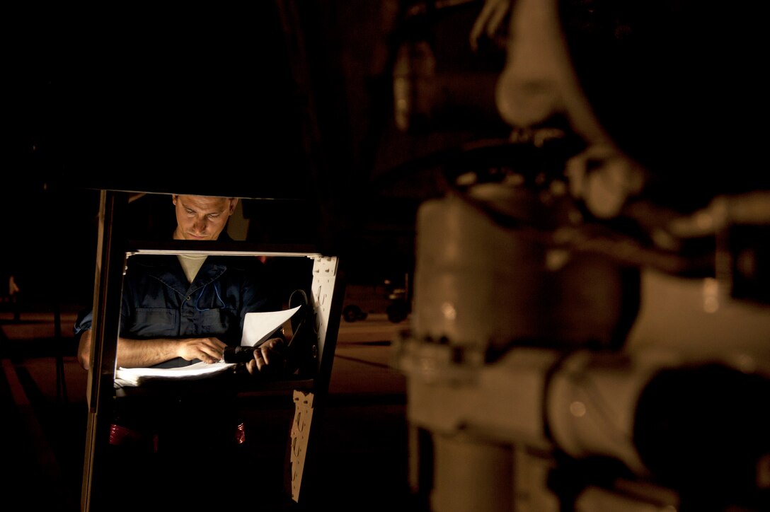 Senior Airman Jeremy Holloway, a dedicated crew chief assigned to the 28th Aircraft Maintenance Squadron, updates maintenance records for a B-1 bomber prior to a Red Flag 16-2 night training sortie at Nellis Air Force Base, Nev., March 10, 2016. Exhaustive efforts are made by ground crew members to ensure the operability of their assigned aircraft and in turn, the safety of the aircrew. (U.S. Air Force photo by Senior Airman Joshua Kleinholz/Released)