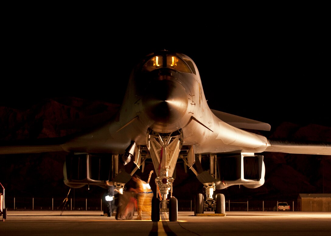 A B-1 bomber assigned to the 28th Bomb Wing receives pre-flight preparations prior to a Red Flag 16-2 night training sortie at Nellis Air Force Base, Nev., March 10, 2016. Red Flag training sorties are typically flown in mass waves featuring various different types of aircraft, making communication and advanced coordination crucial in the pursuit of total safety for all involved. (U.S. Air Force photo by Senior Airman Joshua Kleinholz/Released)