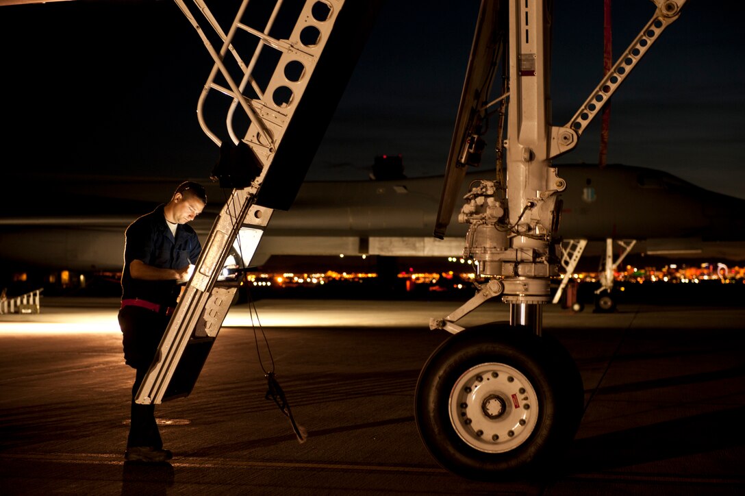 Senior Airman Jeremy Holloway, a dedicated crew chief assigned to the 28th Aircraft Maintenance Squadron, updates maintenance records for a B-1 bomber prior to a Red Flag 16-2 night training sortie at Nellis Air Force Base, Nev., March 10, 2016. Aircraft maintainers work through the night to ensure aircrews continue to receive an effective, but most of all safe, training experience. (U.S. Air Force photo by Senior Airman Joshua Kleinholz/Released)