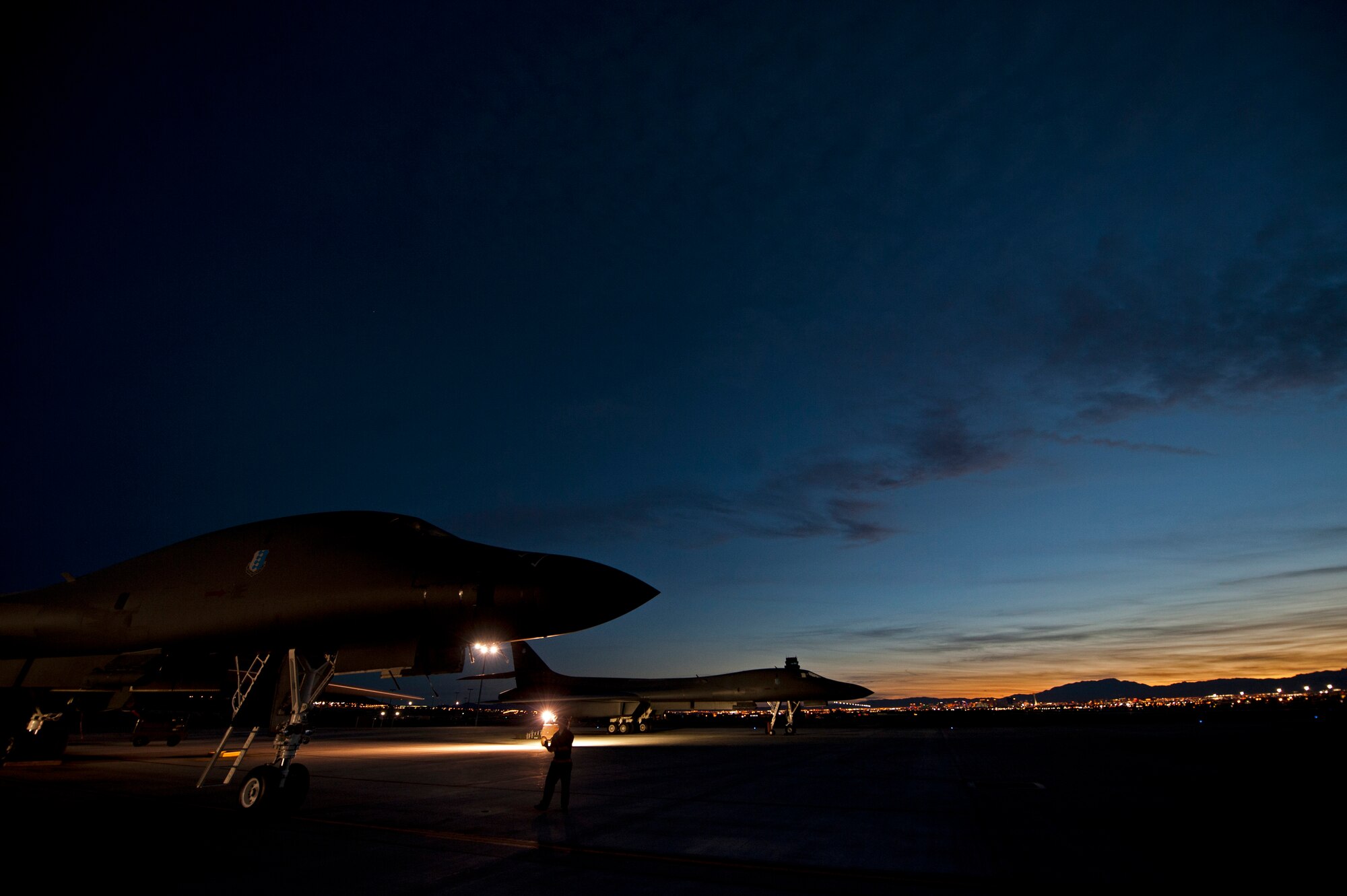 B-1 bombers assigned to the 28th Bomb Wing receive pre-flight preparations prior to a Red Flag 16-2 night training sortie at Nellis Air Force Base, Nev., March 10, 2016. Night missions play a crucial role in Red Flag exercises, allowing aircrews and maintainers the opportunity to test their skills in challenging low-light conditions. (U.S. Air Force photo by Senior Airman Joshua Kleinholz/Released)