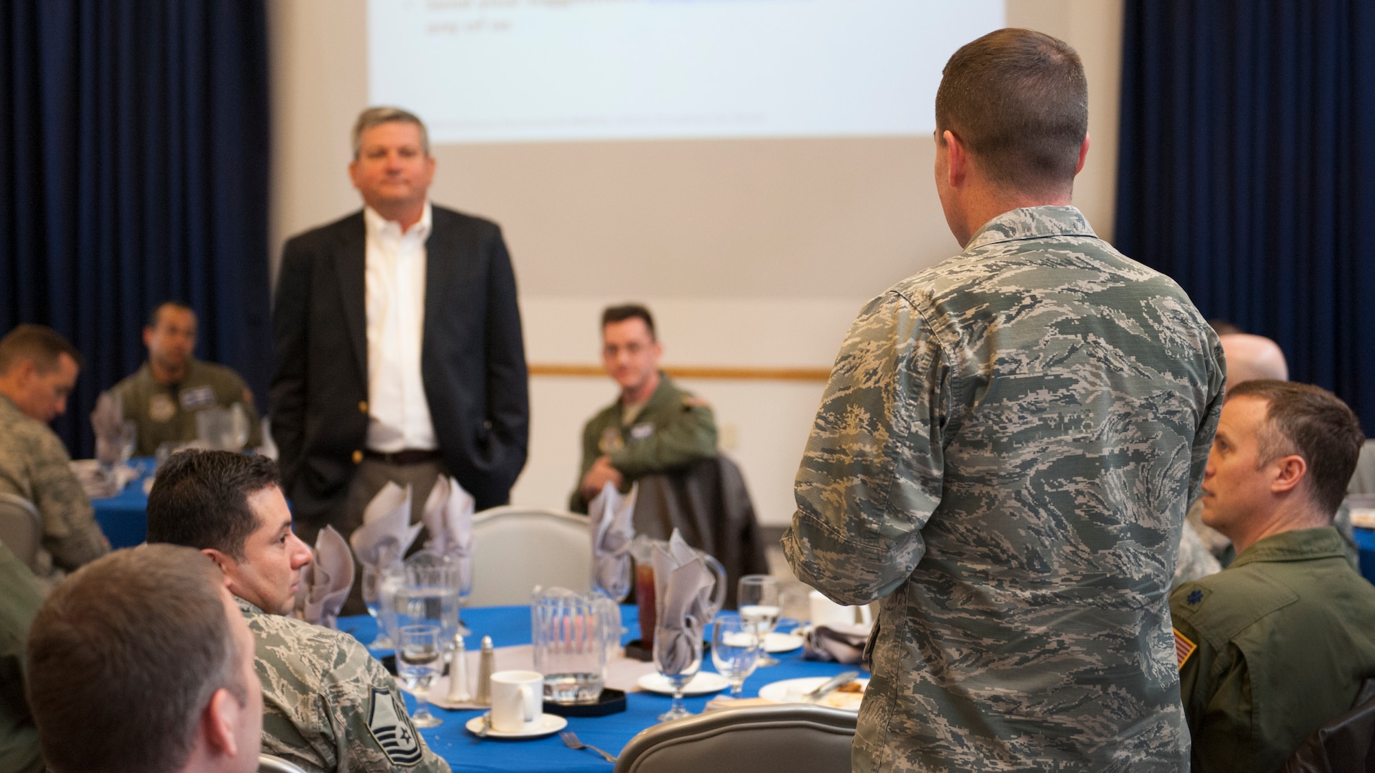 Lt. Col. Charles Throckmorton, 436th Operations Support Squadron director of operations, asks a question to Retired Lt. Gen. Vern “Rusty” Findley, Airlift/Tanker Association executive director, at a Leadership Luncheon March 4, 2016, at the Landings on Dover Air Force Base, Del. Findley shared many stories and experiences from his Air Force career. (U.S. Air Force photo/Senior Airman Zachary Cacicia)