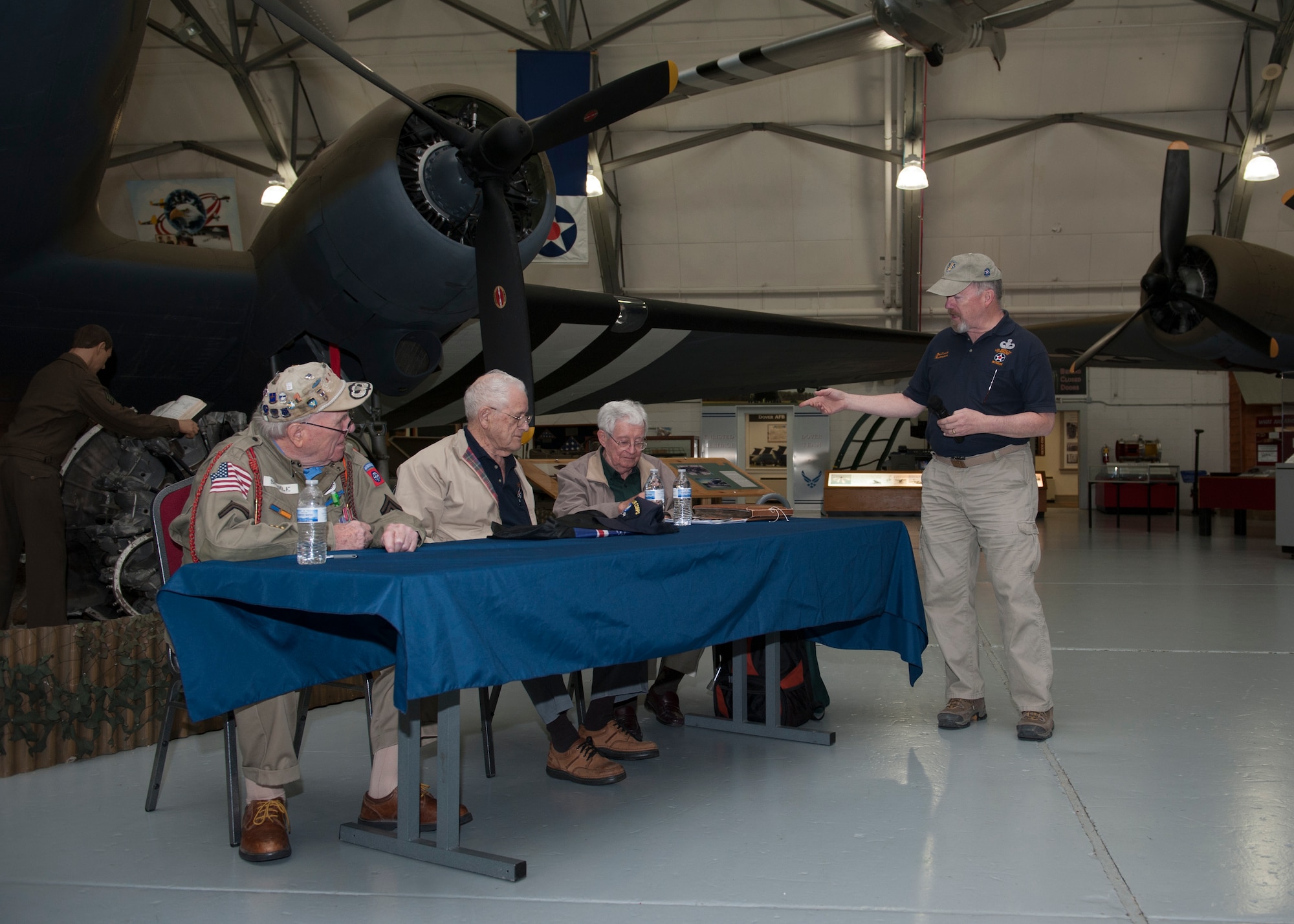 Retired U.S. Army Col. Bob Leicht, Air Mobility Command Museum volunteer, introduces World War II C-47A Skytrain veterans George Shenkle, left, Don Clark, center, and Ray Pegram March 12, 2016, at the AMC Museum on Dover Air Force Base, Del. Each veteran spoke on their war experiences with the C-47. (U.S. Air Force photo/Senior Airman Zachary Cacicia)