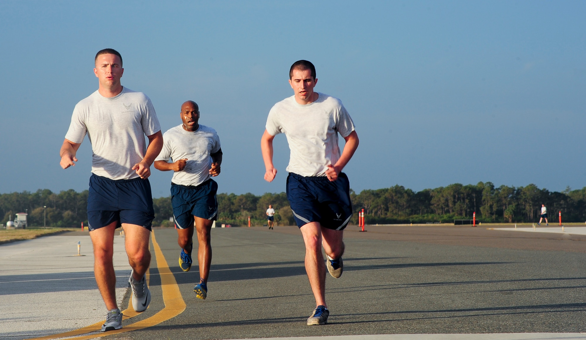 Members from Team MacDill participate in the annual Richard “Dick” Cutshall AirFest Memorial Run, March 11, 2016, at MacDill Air Force Base, Fla. The run is held annually in memory of the original “Air Boss,” who started what is known today as AirFest.  (U.S. Air Force photo by Senior Airman Jenay Randolph) 