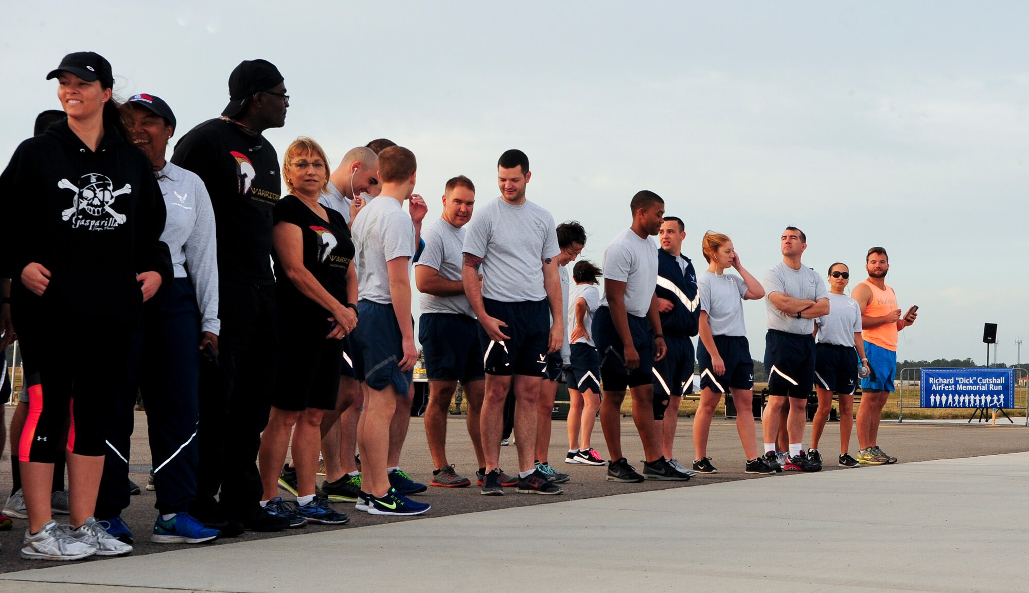 Participants line up along the starting line preparing for the annual Richard “Dick” Cutshall AirFest Memorial Run, March 11, 2016, at MacDill Air Force Base, Fla. The run kicked-off the Tampa Bay AirFest 2016 activities. (U.S. Air Force photo by Senior Airman Jenay Randolph) 