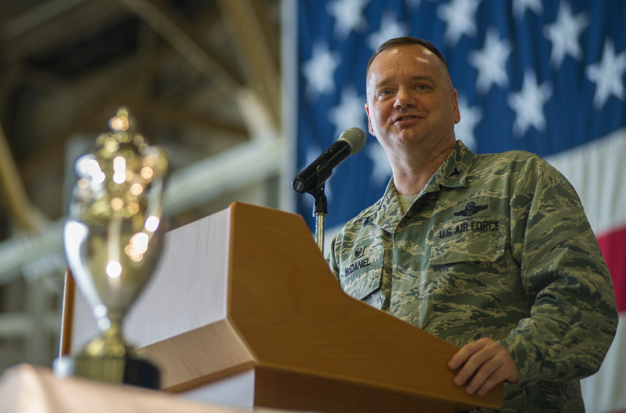 U.S. Air Force Col. Brian McDaniel, 92nd Air Refueling Wing commander, provides remarks after accepting the 2015 Omaha Trophy, strategic aircraft category, on behalf of his unit during an award ceremony at Fairchild Air Force Base, Wash., March 14, 2016. U.S. Air Force Lt. Gen. Stephen W. Wilson (not pictured), U.S. Strategic Command (USSTRATCOM) deputy commander, and Mr. W. Gary Gates (not pictured), Strategic Command Consultation (SCC) Committee member, presented the trophy to McDaniel and other base leaders in recognition of the 92nd Air Refueling Wing’s contributions to USSTRATCOM’s global strategic missions. The Omaha Trophy, which dates back to the U.S. Air Force’s Strategic Air Command, was originally created by the SCC in 1971. At the time, a single trophy was presented annually as a token of appreciation to USSTRATCOM’s best wing. Since then, the tradition has evolved to unit-level awards that recognize the command’s premier intercontinental ballistic missile (ICBM) wing, ballistic missile submarine, strategic bomber wing and global operations (space/cyberspace) unit. This year, a new category was added to include the combatant command’s top strategic aircraft wing. (U.S. Air Force photo by Airman 1st Class Sean Campbell)