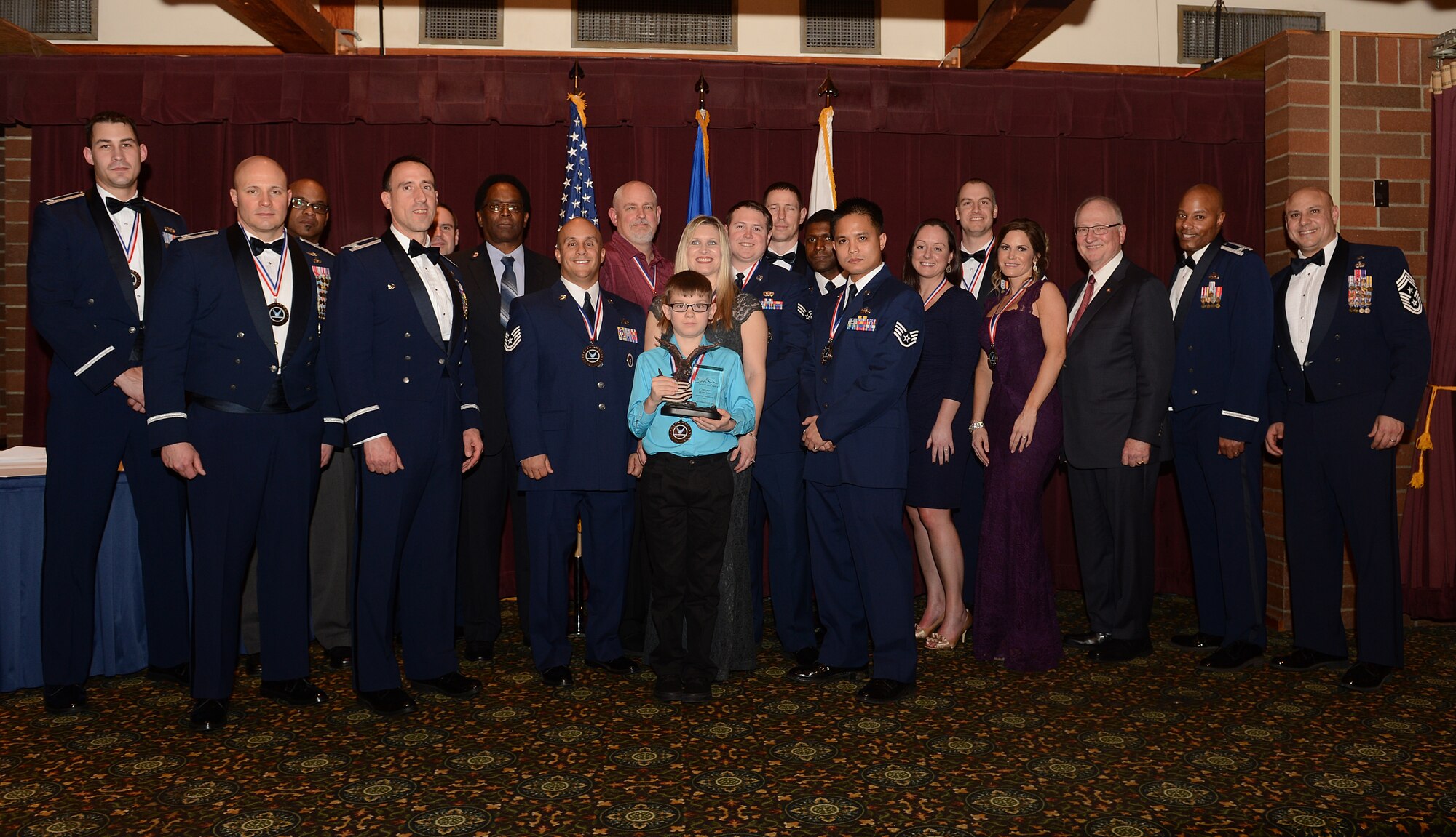 Award winners of the 2015 Team McChord Annual Awards Banquet pose for a photo after the ceremony March 11, 2016 at Joint Base Lewis-McChord, Wash. The theme for this year’s banquet was wingman, leader, warrior and the guest speaker was Maj. Gen. (ret) James Collins. (U.S. Air Force photo/Senior Airman Divine Cox)