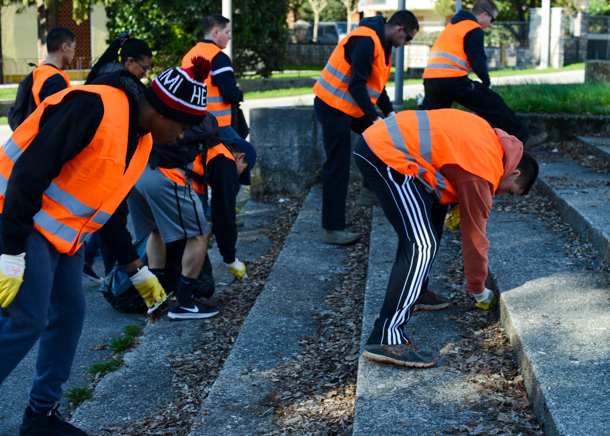 U.S. Air Force Airmen pick up trash during a city-wide trash cleanup, March 13, 2016, in Aviano, Italy. Approximately 200 local and base volunteers participated in the event. (U.S. Air Force photo by Senior Airman Austin Harvill/Released)