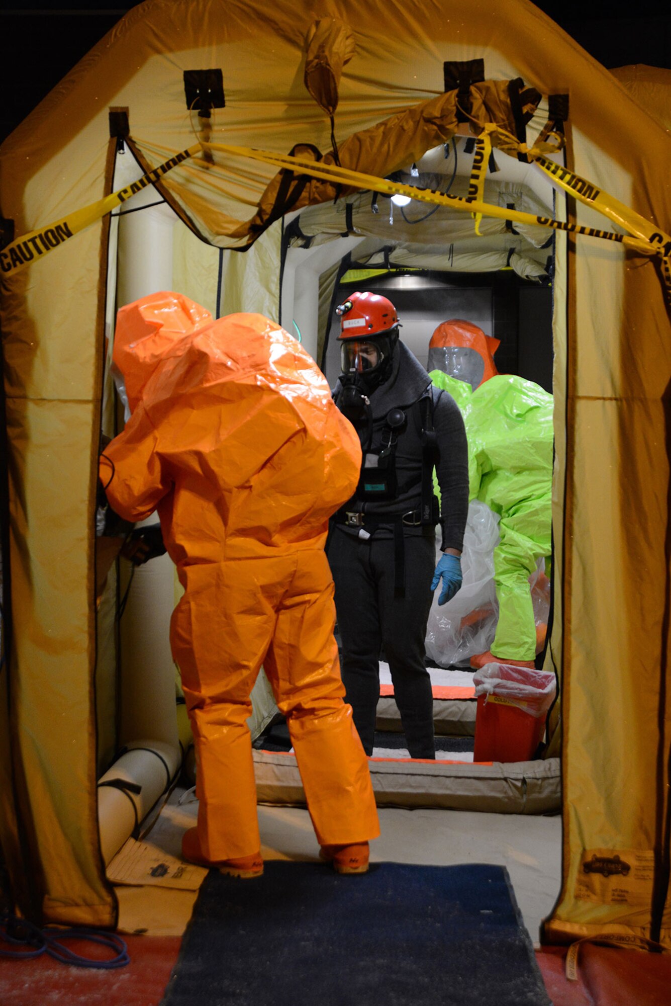 Members of the Alaska National Guard’s 103d Civil Support Team prepare to be decontaminated during their technical proficiency evaluation test for federal recognition as a regional chemical, biological, radiological and nuclear response unit in Anchorage, Alaska, Feb. 16, 2016. (U.S. Air Force photo by Airman 1st Class Christopher R. Morales)