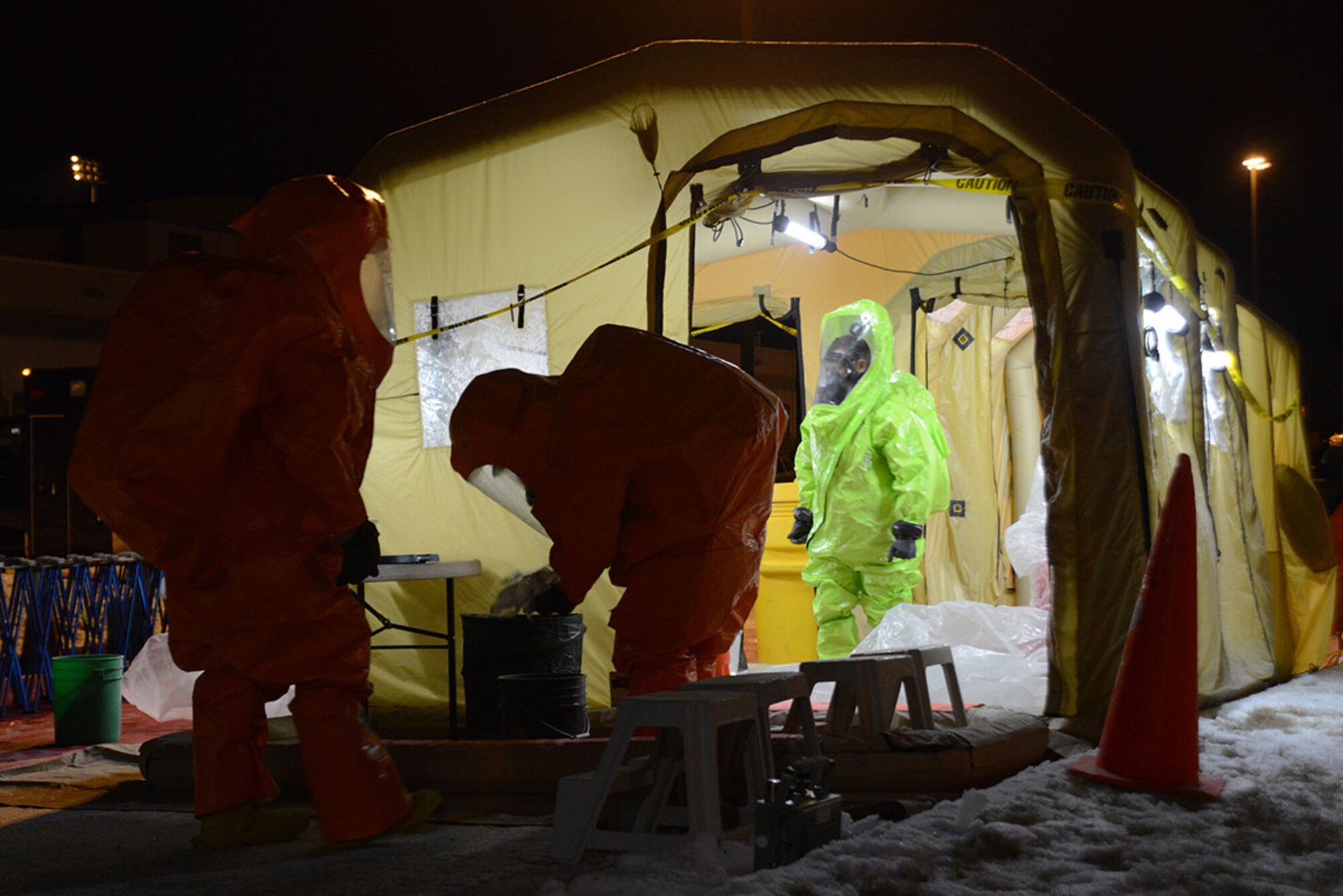 Members of the Alaska National Guard’s 103d Civil Support Team prepare to be decontaminated during their technical proficiency evaluation test for federal recognition as a regional chemical, biological, radiological and nuclear response unit in Anchorage, Alaska, Feb. 16, 2016. (U.S. Air Force photo by Airman 1st Class Christopher R. Morales)