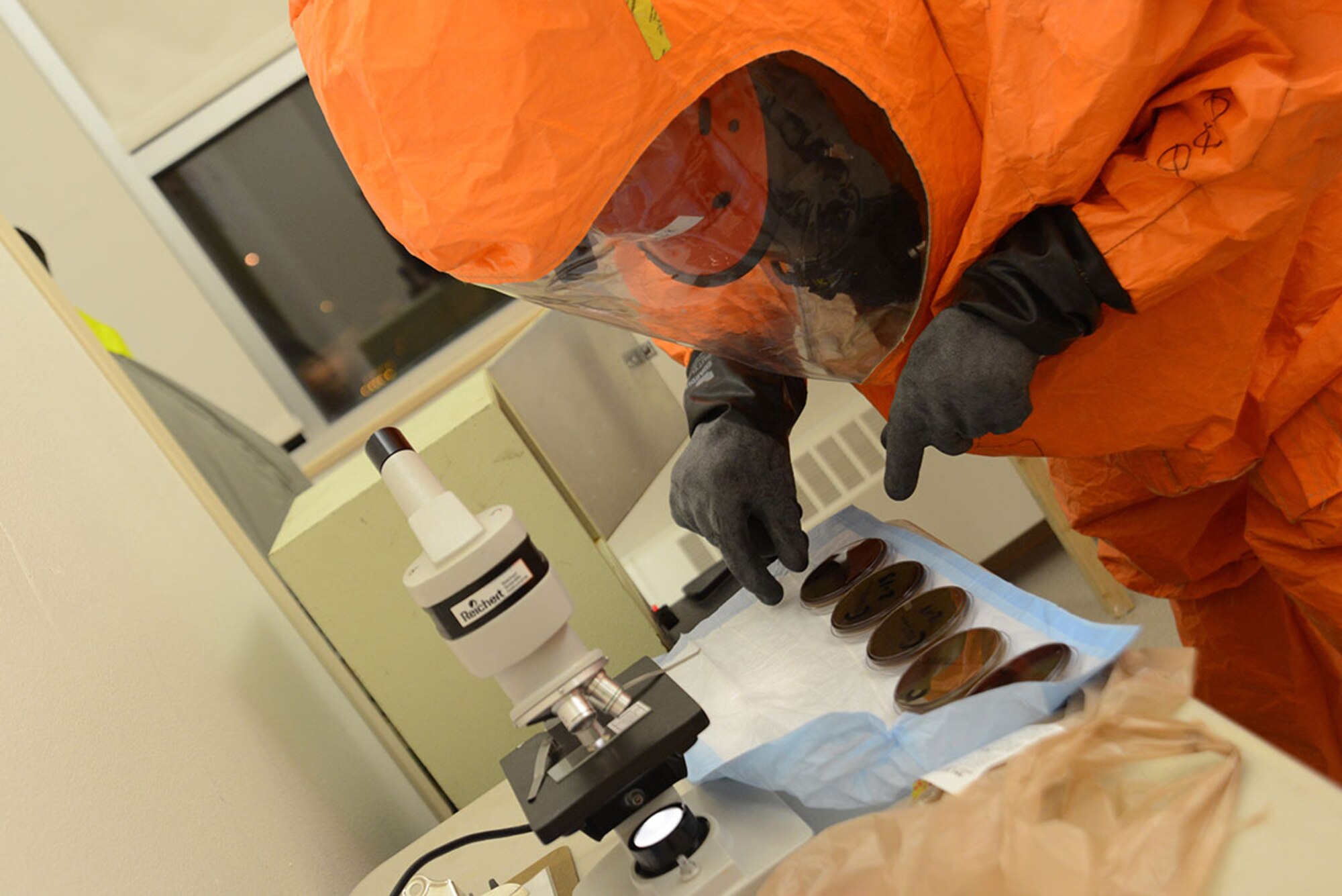 A specialist with the Alaska National Guard’s 103d Civil Support Team places samples on a sanitation sheet during their technical proficiency evaluation test for federal recognition as a regional chemical, biological, radiological and nuclear response unit in Anchorage, Alaska, Feb. 16, 2016. (U.S. Air Force photo by Airman 1st Class Christopher R. Morales)