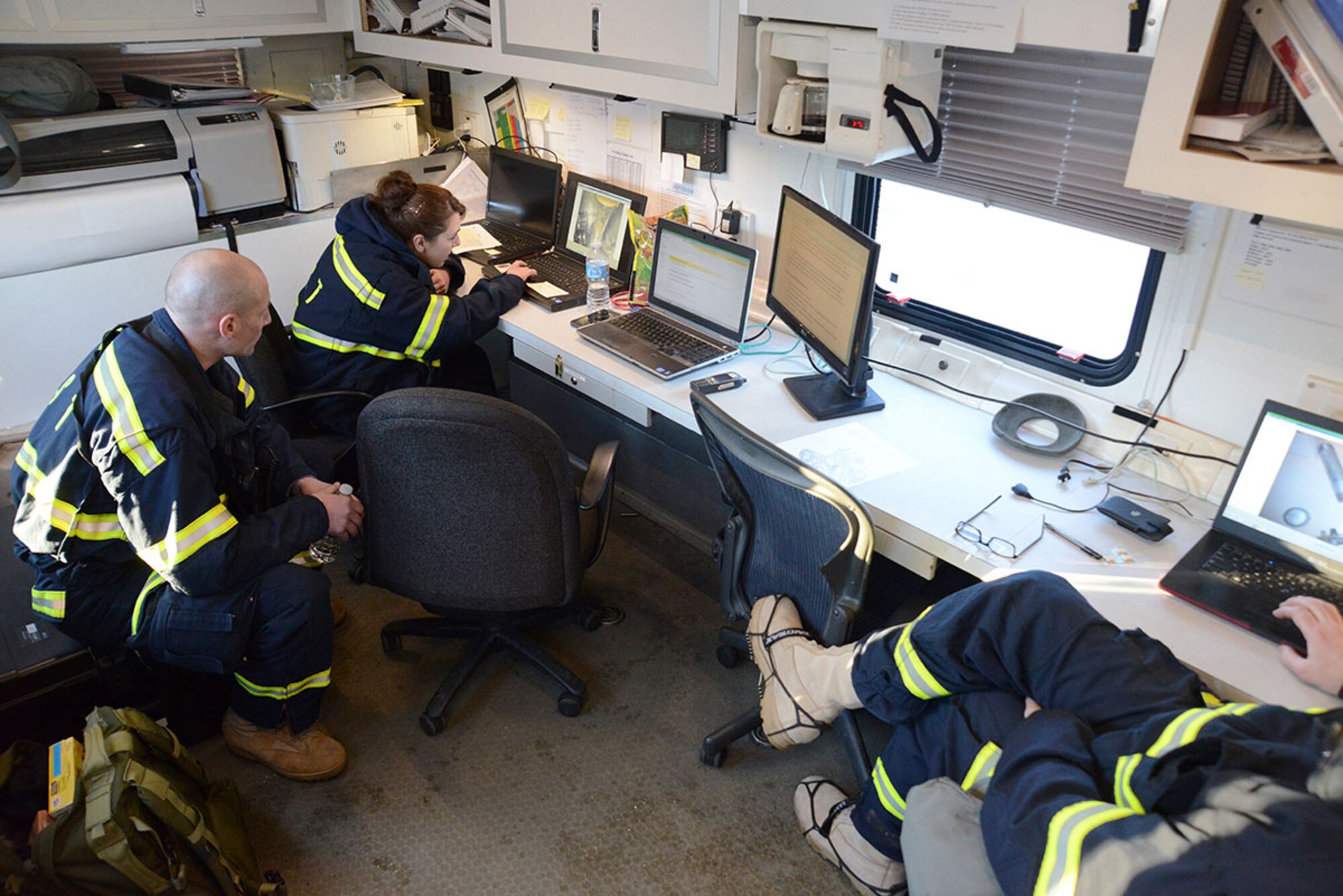 Members of the Alaska National Guard’s 103d Civil Support Team analyze the photos taken by the reconnaissance team during their technical proficiency evaluation test for federal recognition as a regional chemical, biological, radiological and nuclear response unit in Anchorage, Alaska, Feb. 16, 2016. (U.S. Air Force photo by Airman 1st Class Christopher R. Morales)