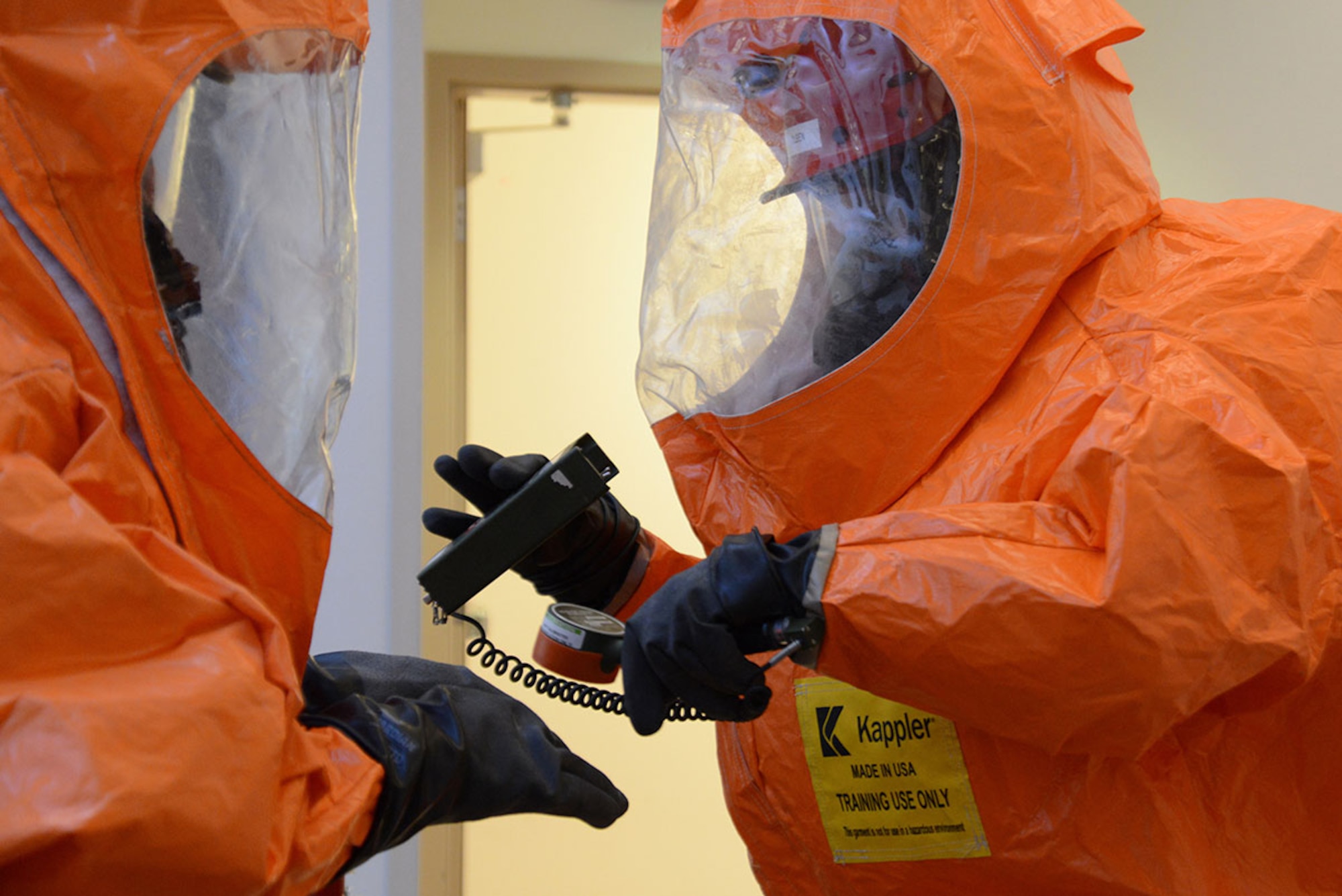 An Alaska National Guard’s 103d Civil Support Team chemical, biological, radiological and nuclear specialist scans for any contamination before exiting a building during their technical proficiency evaluation test for federal recognition as a regional CBRN unit in Anchorage, Alaska, Feb. 16, 2016. (U.S. Air Force photo by Airman 1st Class Christopher R. Morales)