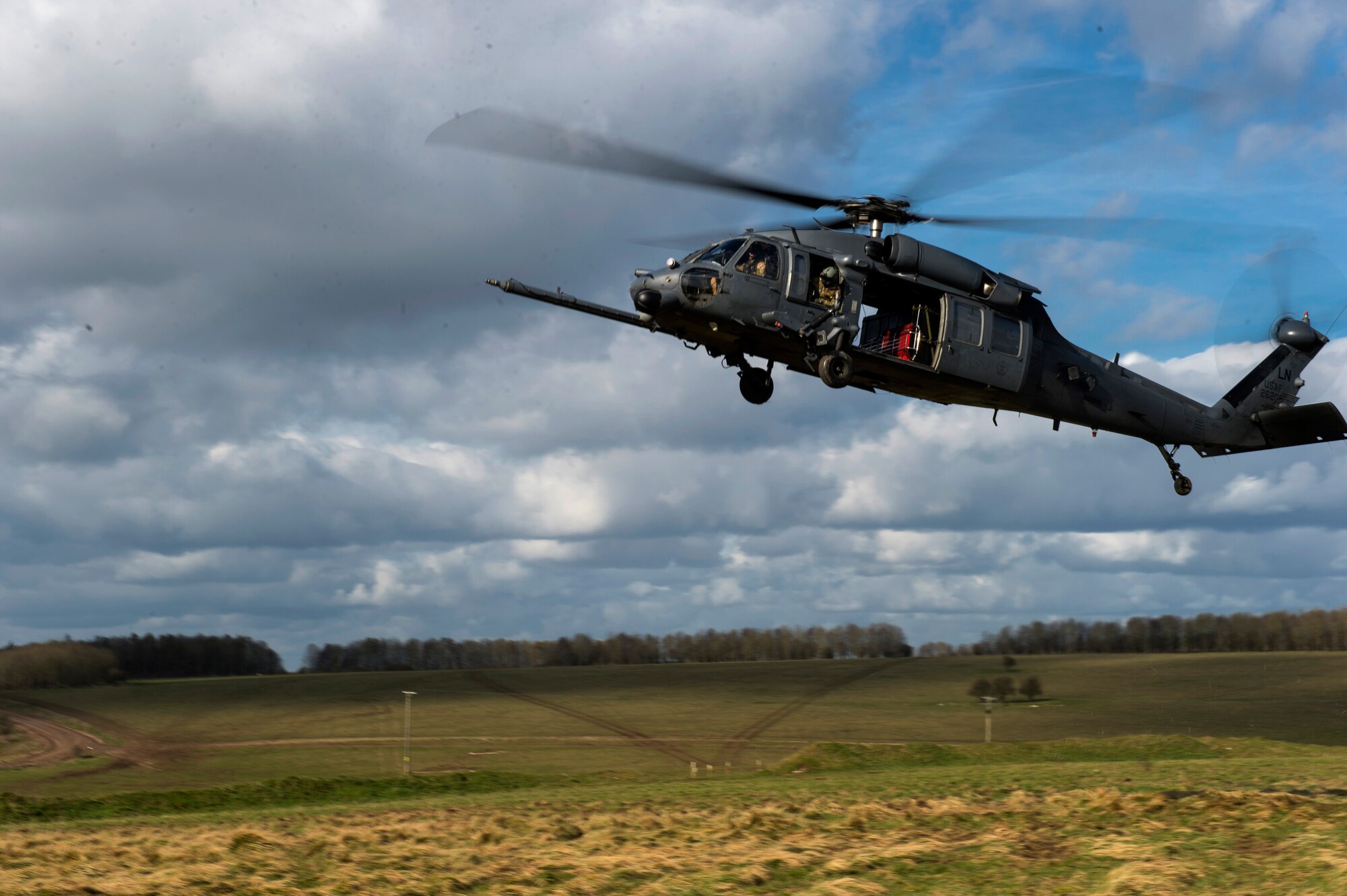 An HH-60G Pave Hawk from the 56th Rescue Squadron prepares to land during exercise Voijek Valour at Salisbury Plain, England, March 4, 2016. The 56th RQS provides humanitarian assistance, non-combatant evacuation and disaster relief capability for the U.S. European Command combatant commander and the Joint Chiefs of Staff in peacetime. (U.S. Air Force photo/Staff Sgt. Emerson Nuñez)