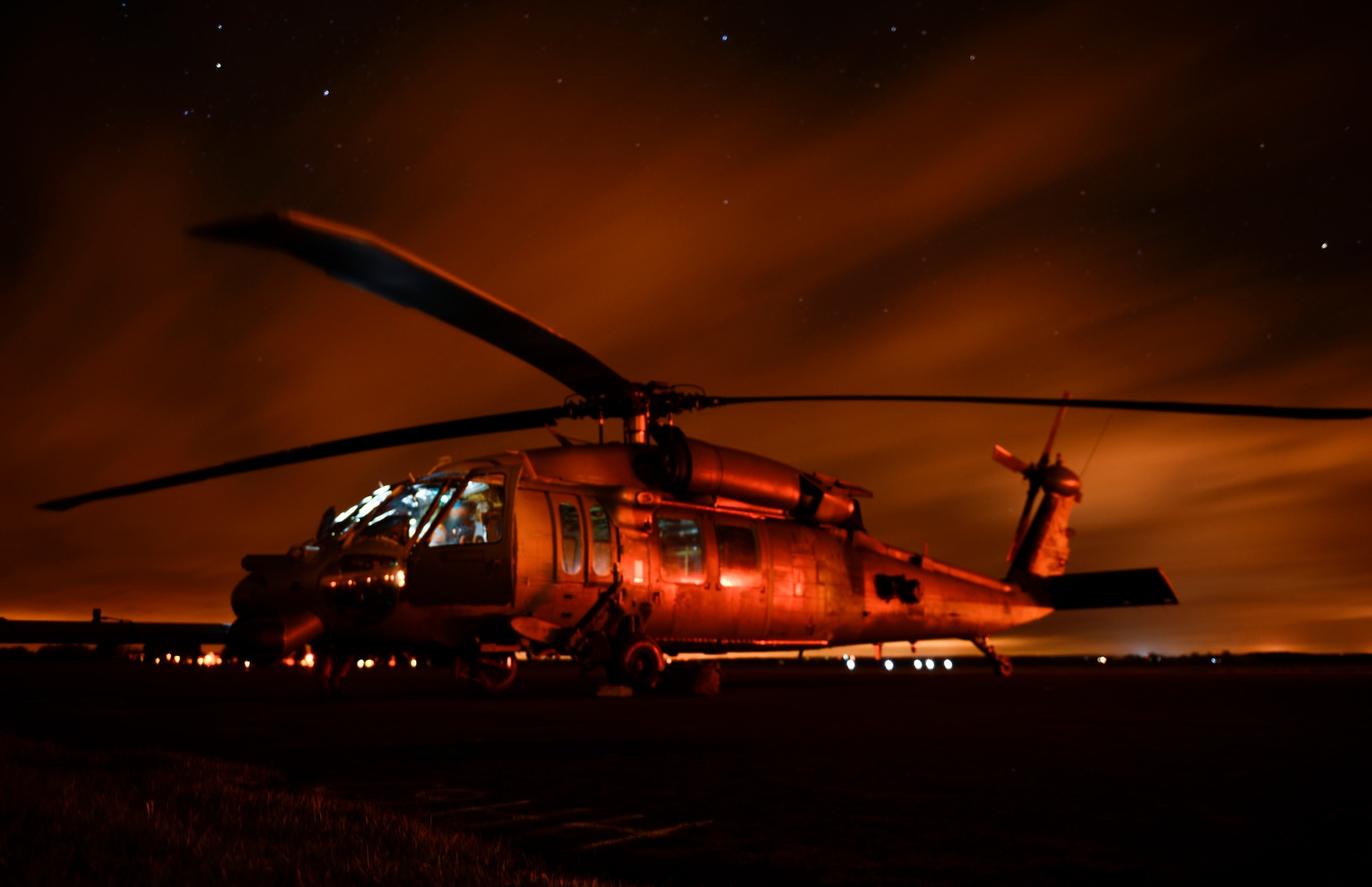 Members of the 56th Rescue Squadron conduct post-flight inspections on an HH-60G Pave Hawk during exercise Voijek Valour at Hullavington Airfield, England, March 3, 2016. The 56th RQS provides humanitarian assistance, non-combatant evacuation and disaster relief capability for the U.S. European Command combatant commander and the Joint Chiefs of Staff in peacetime. (U.S. Air Force photo/Staff Sgt. Emerson Nuñez)