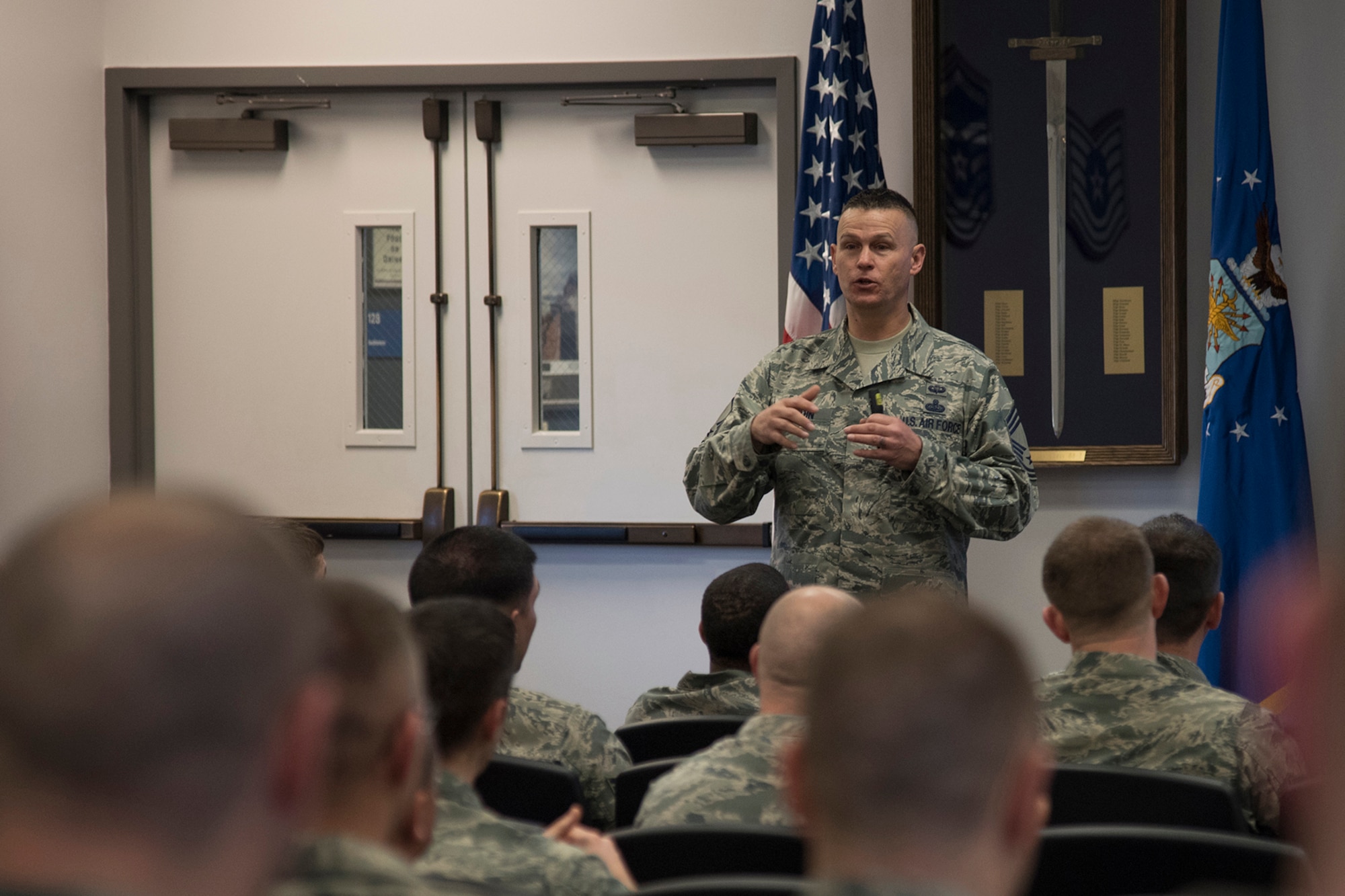 PETERSON AIR FORCE BASE, Colo. – Chief Master Sgt. Bob Woodin, Vosler Noncommissioned Officer Academy commandant, briefs the benefits of the new Intermediate Learning Experience course to the first NCOs attending the course at Peterson Air Force Base, Colo., March 9, 2016. The Vosler NCOA instructors have transitioned their academy course from the Legacy program to the new ILE course for the new class. The result is a more student-centered learning program. (U.S. Air Force photo by Staff Sgt. Tiffany DeNault)