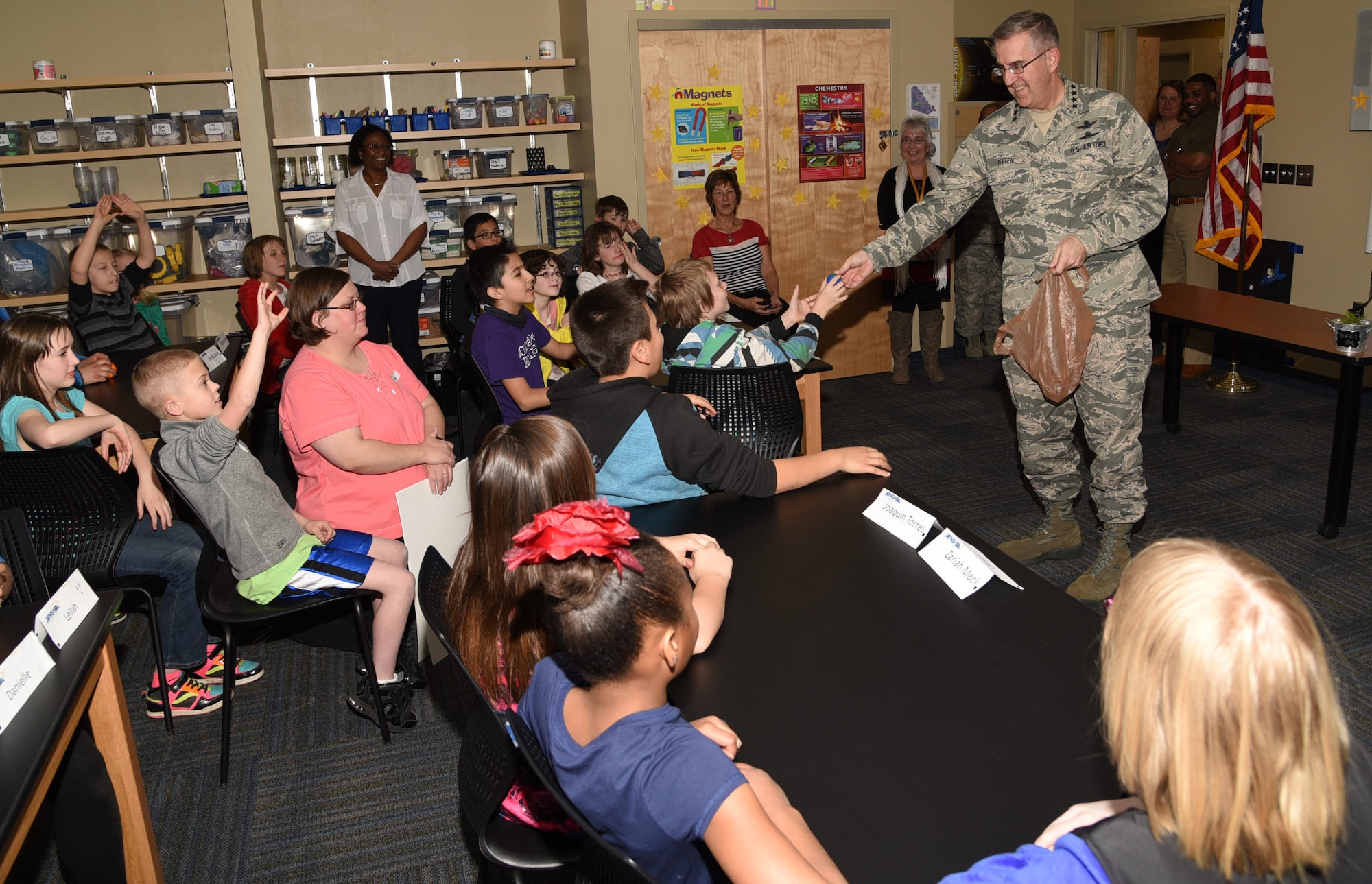 PETERSON AIR FORCE BASE, Colo. - Gen. John E. Hyten, Air Force Space Command commander, talks with students March 11, 2016 at the Peterson Air Force Base STARBASE academy. STARBASE selects fifth grade students from local public schools and focuses on Science, Technology, Engineering and Mathematical education. (U.S. Air Force photo by Robb Lingley)