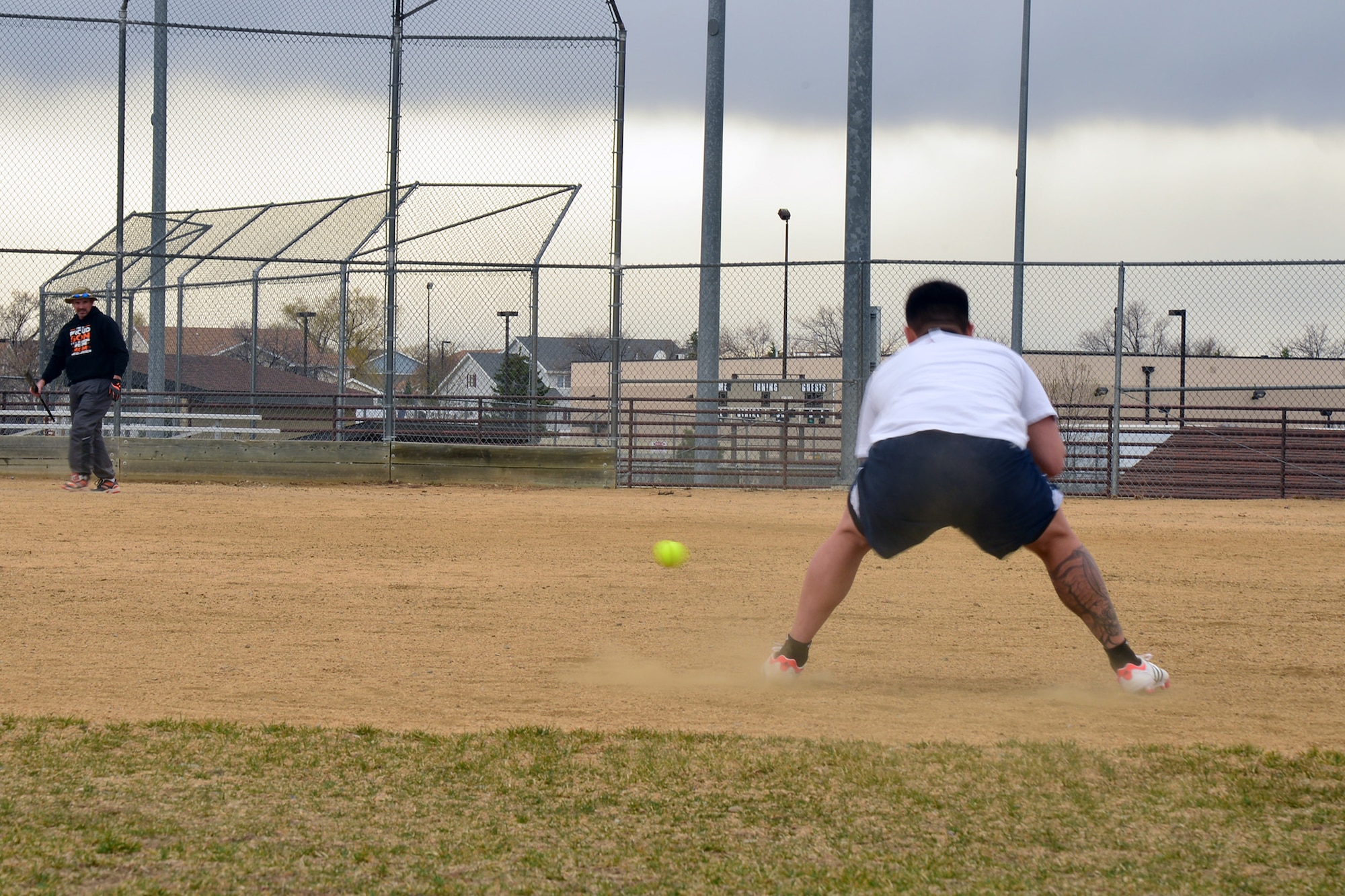 An Airman fields a ground ball at softball team tryouts March 12, 2016, at Malmstrom Air Force Base, Mont. Members selected for the team will travel to military softball tournaments across the U.S. to represent the 341st Missile Wing. (U.S. Air Force photo/Airman Daniel Brosam)