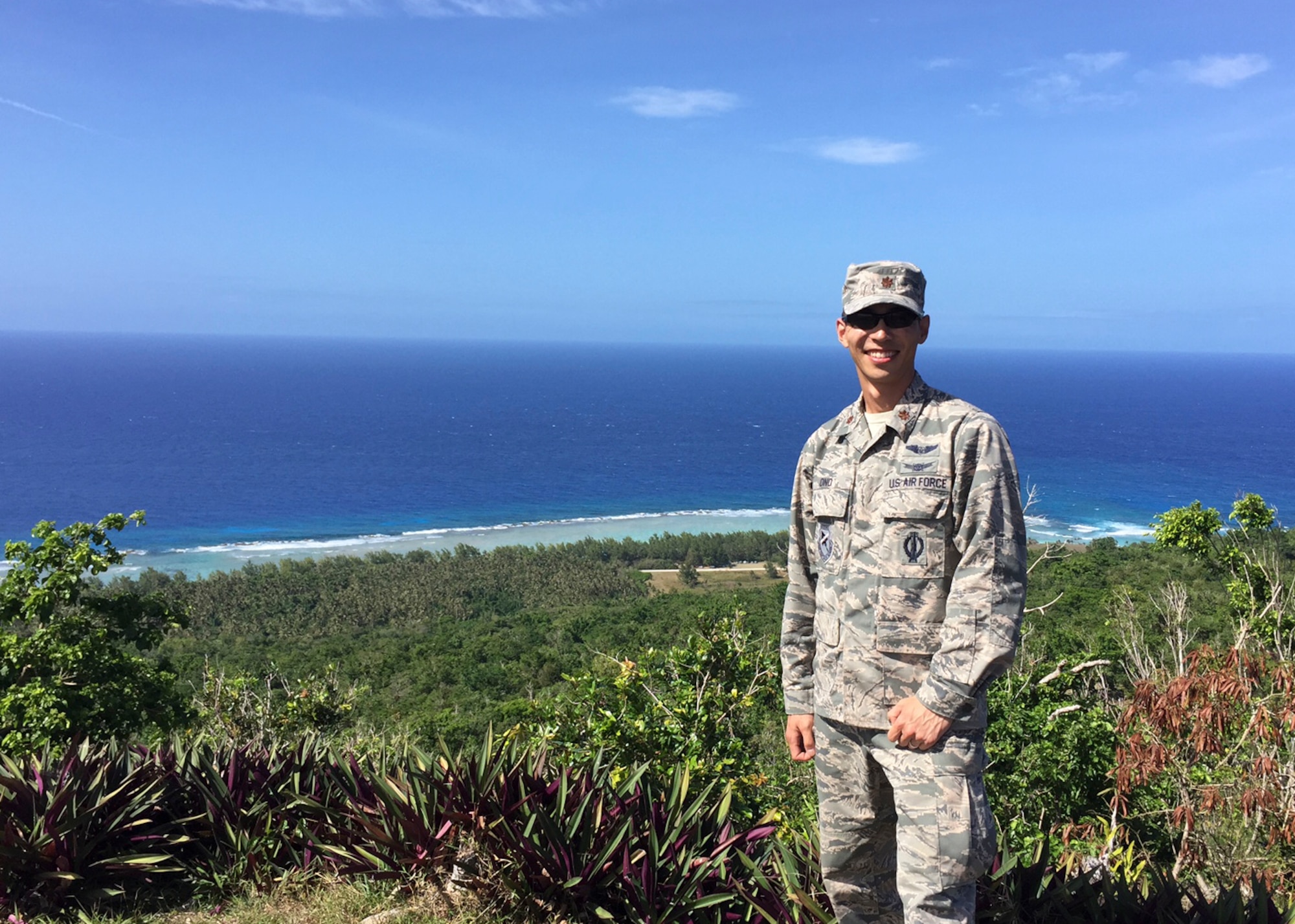Maj. Tomoyuki Ono, U.S. Test Pilot School, Flying Qualities chief, poses for a picture on the coast of Guam in the Pacific Ocean. Ono had the chance to participate in a Silver Flag exercise at Andersen Air Force Base last month, thanks to the Air Force's Language Enabled Airmen Program. (Courtesy photo)