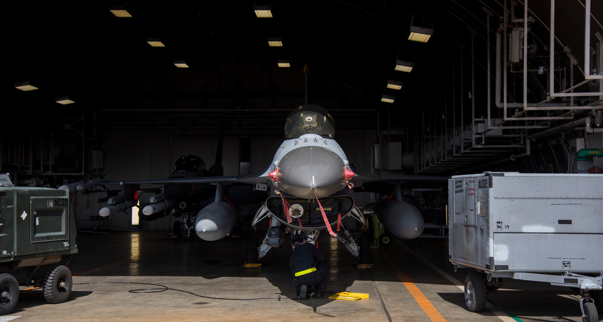 An F-16 Fighting Falcon with the 14th Fighter Squadron at Misawa Air Base, Japan, sits in a hangar March 15, 2016. Today marked the beginning of Beverly Sunrise 16-03, which is an operational readiness exercise to validate the state of the wing's war readiness. (U.S. Air Force photo by Senior Airman Brittany A. Chase)