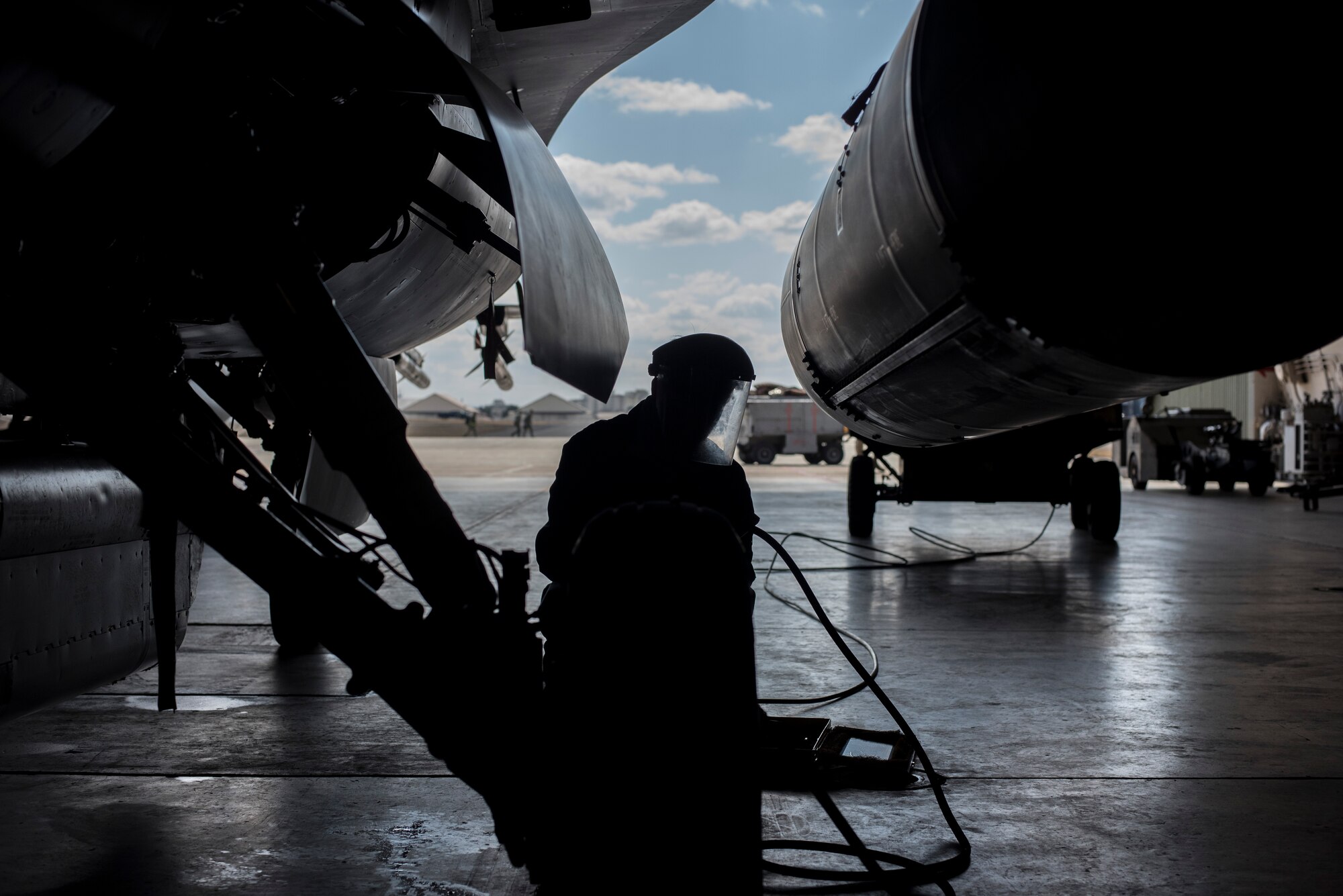 U.S. Air Force Senior Airman Bradley Poirier, a crew chief with the 14th Aircraft Maintenance Squadron, checks pressure on an F-16 Fighting Falcon tire at Misawa Air Base, Japan, March 15, 2016. Tire pressure is regularly checked to ensure the Fighting Falcon is prepared to take flight at a moment’s notice. (U.S. Air Force photo by Senior Airman Brittany A. Chase)