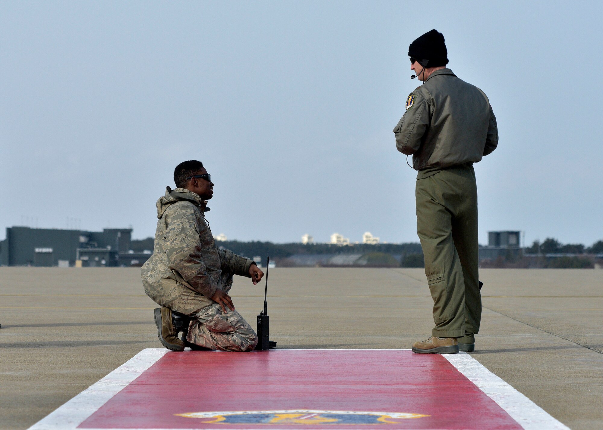 U.S. Air Force Staff Sgt. Roddrick Davenport, the avionics lead with the Pacific Air Forces’ F-16 Demonstration Team, left, and Maj. Austin Brown, the outgoing pilot with the PACAF Demonstration Team, right, reviews the performance at Misawa Air Base, Japan, March 10, 2016. When demonstration team Airmen are not traveling for air shows, they are still assigned to their respective squadrons and perform primary duties. (U.S. Air Force photo by Senior Airman Deana Heitzman)