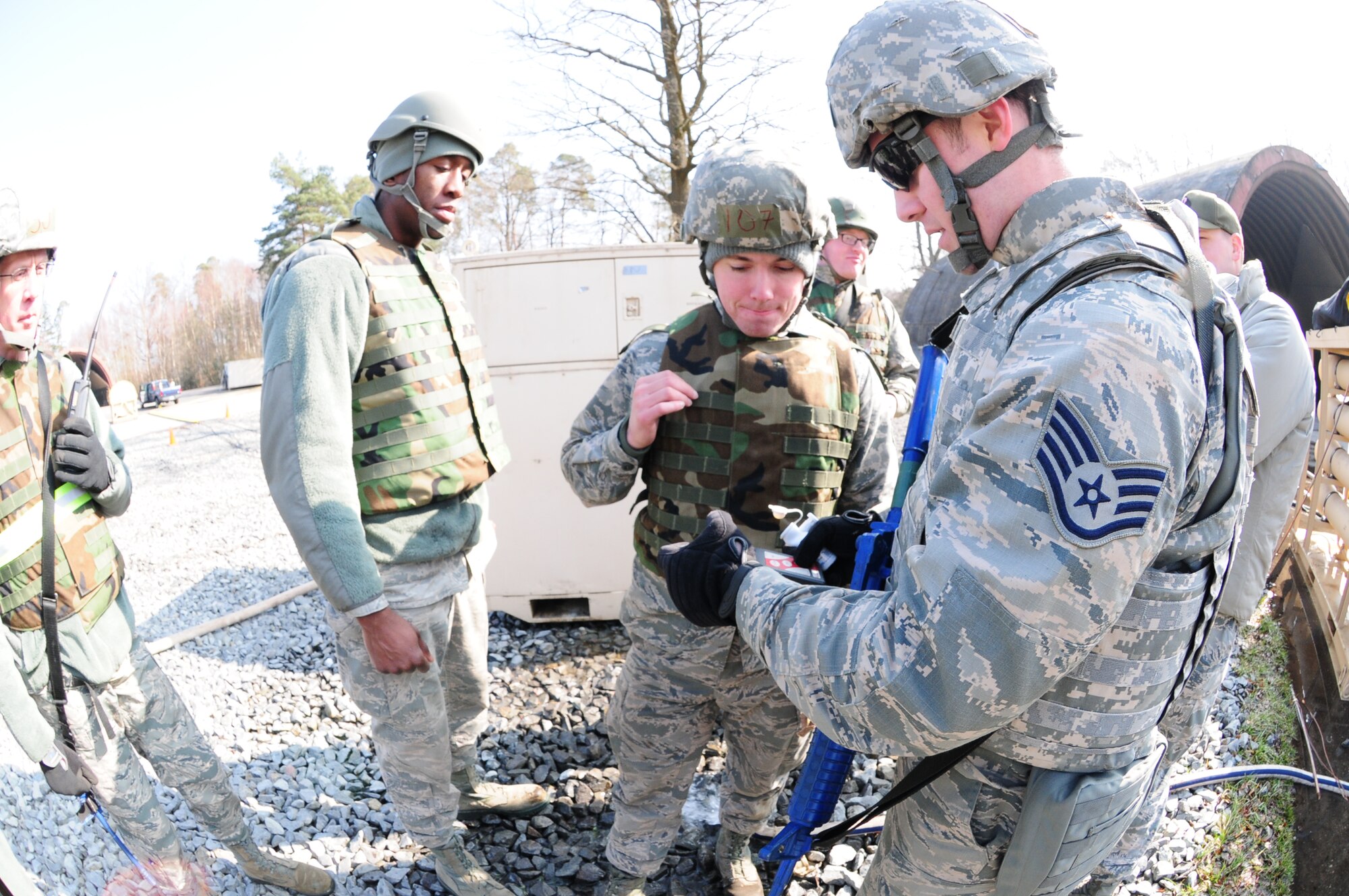 Civil engineer water and fuels systems maintainers perform checks on filtered water for chlorine or other impurities during the simulated deployment site at Silver Flag in Ramstein Air Base, Germany, March 12. Silver Flag is an every 36 months required training for Air Force civil engineer specialties. (U.S. Air National Guard photo by Senior Airman Erica Rodriguez)