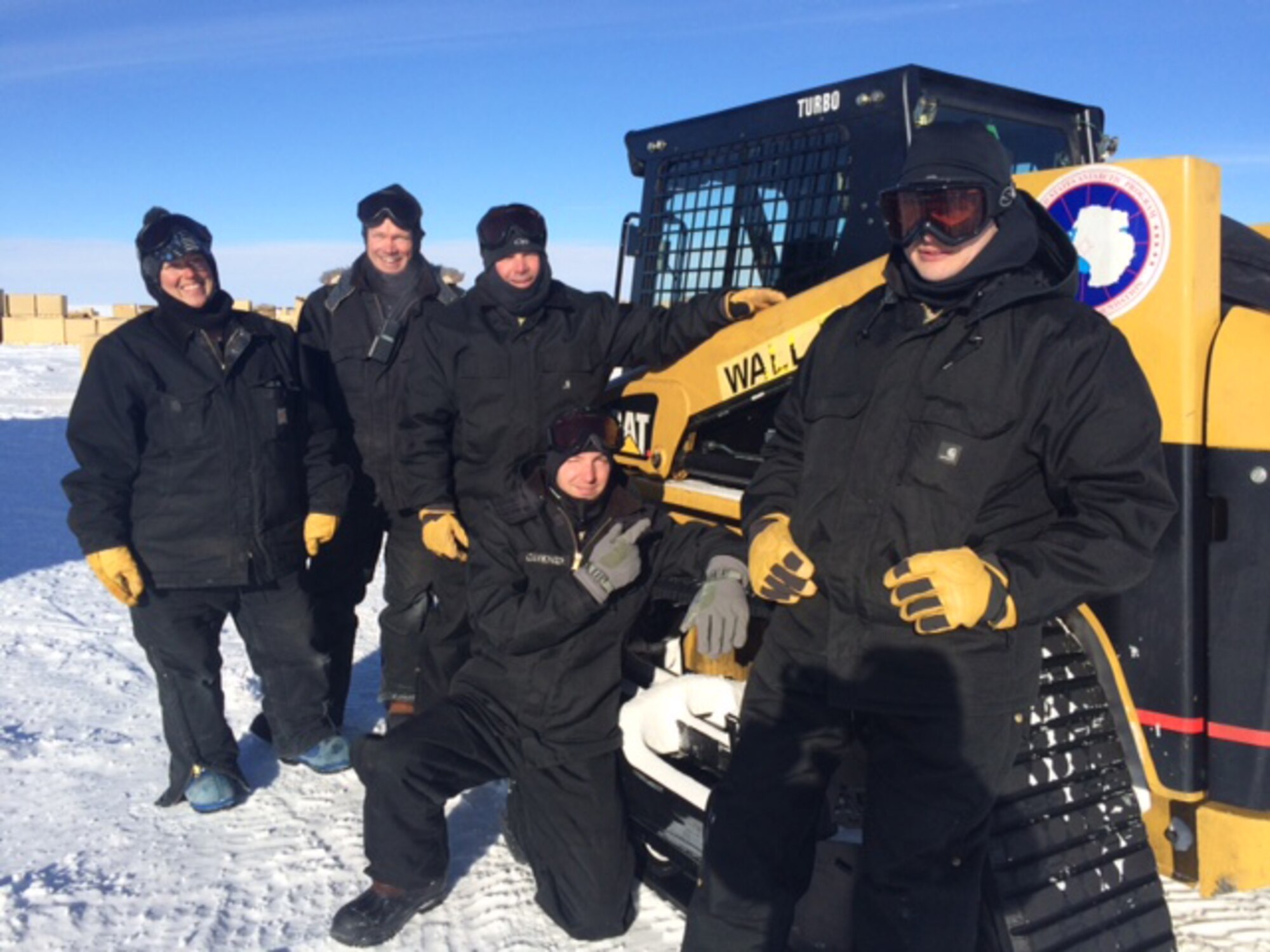 (From left) Two contracters with the National Science Foundation helped Tech. Sgts. Adam Myers, Justin Carkner and Caleb Brumleve build pallets of retrocargo at the South Pole Station in January 2016. The team was tasked to build and inspect pallets of excess and obsolete materials currently stored at the South Pole Station as part of the newly established South Pole Retrograde Initiative. Myers, Carkner and Brumleve are assigned to the 109th Airlift Wing. (Courtesy photo)