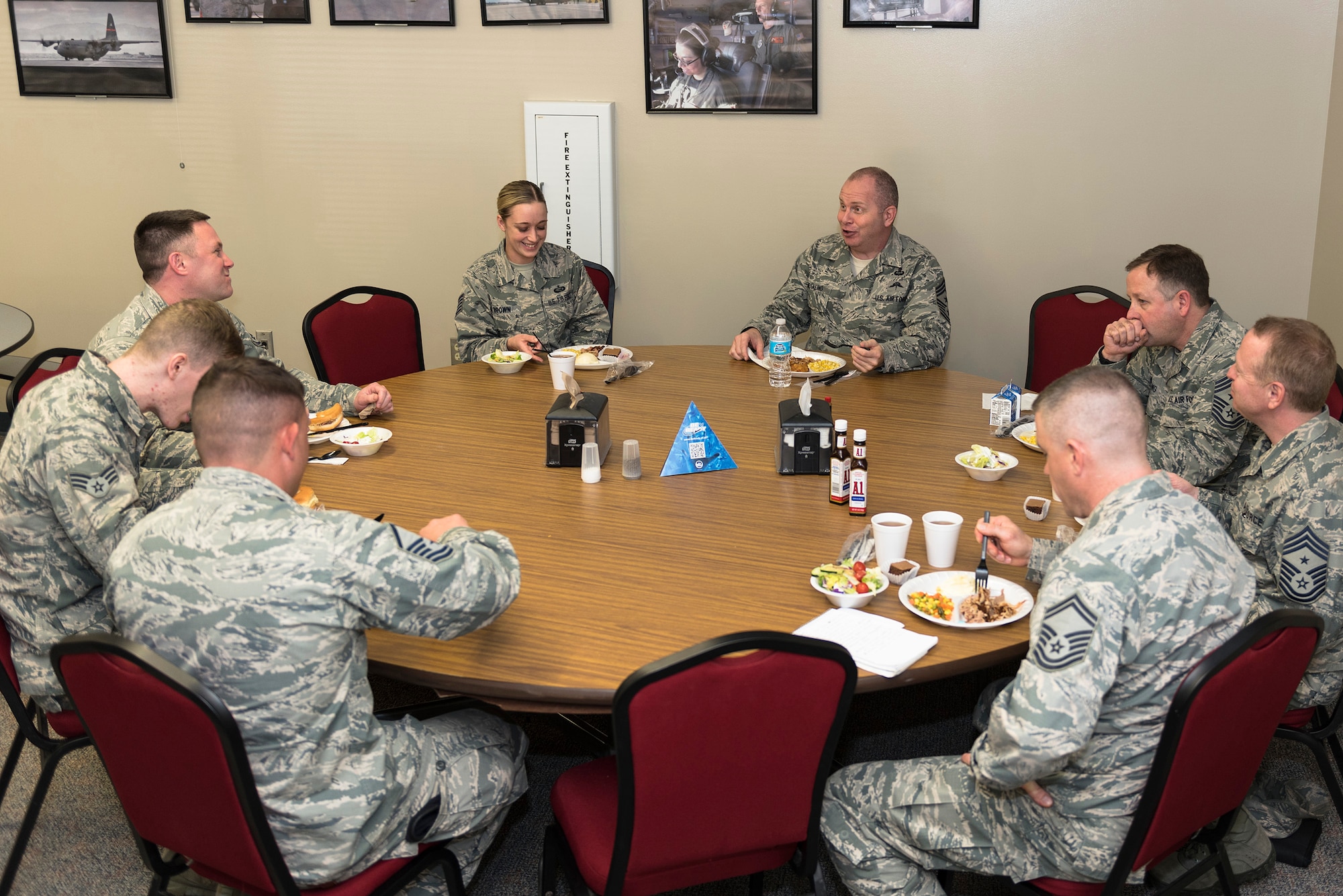 U.S. Air Force Chief Master Sgt. James W. Hotaling, top center-right, the command chief of the Air National Guard, eats lunch with the Illinois Air National Guard 182nd Airlift Wing’s outstanding Airmen of the year in Peoria, Ill., March 4, 2016. Hotaling visited the wing’s enlisted corps to discuss renewing the commitment to the profession of arms, the health of the force and embracing accomplishments. (U.S. Air National Guard photo by Staff Sgt. Lealan Buehrer)