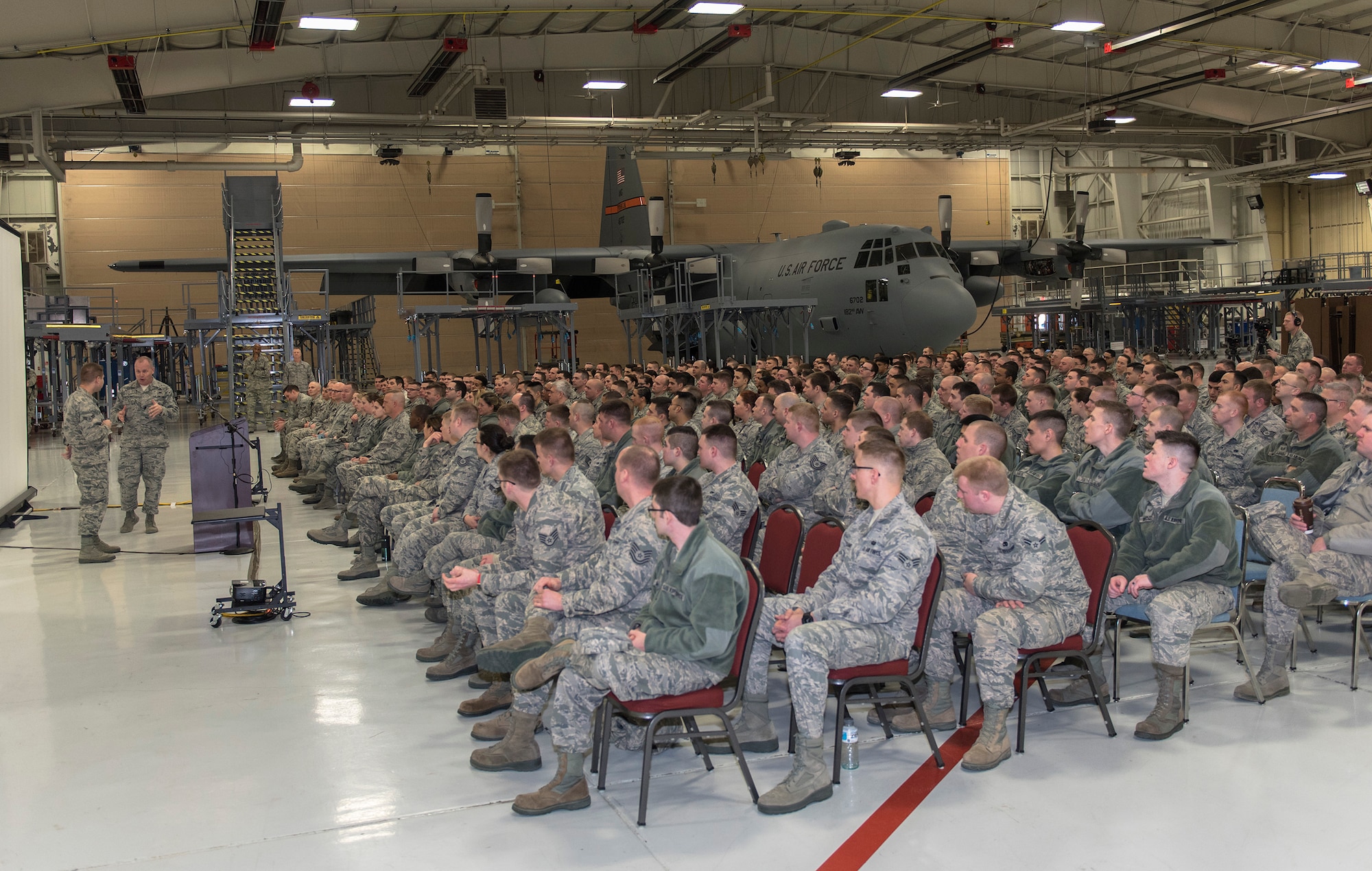 U.S. Air Force Chief Master Sgt. James W. Hotaling, right, the command chief of the Air National Guard, asks Airman 1st Class Kenneth S. Vercellotti, a cyber transportation systems specialist with the 168th Air Support Operations Squadron, Illinois Air National Guard, about his experiences in the military in Peoria, Ill., March 4, 2016. Hotaling visited the wing’s enlisted corps to discuss renewing the commitment to the profession of arms, the health of the force and embracing accomplishments. (U.S. Air National Guard photo by Staff Sgt. Lealan Buehrer)