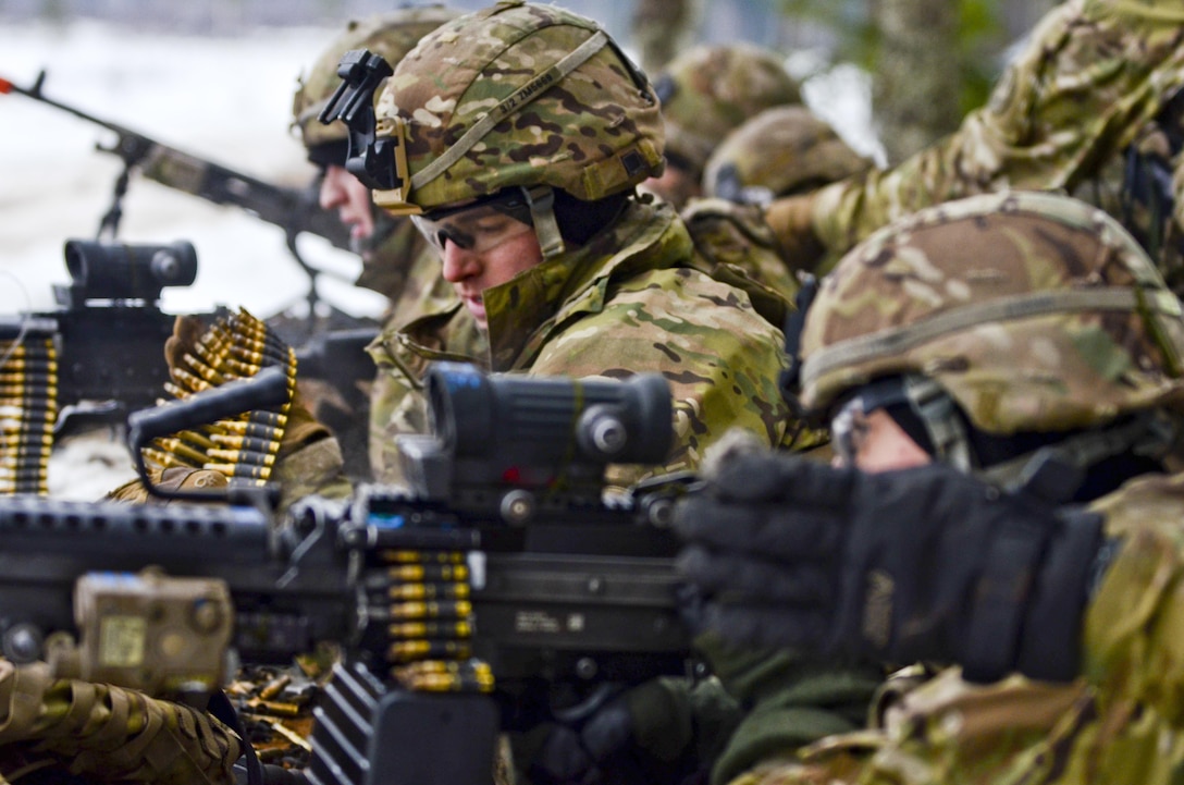 Soldiers return fire at a simulated enemy position with an assault attack during a live-fire exercise at Tapa Training Area in Estonia, March 12, 2016. Army photo by Staff Sgt. Steven M. Colvin