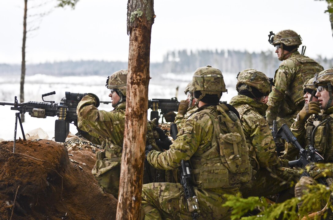 Soldiers set up behind a berm and return fire at a simulated enemy position during a live-fire exercise at Tapa Training Area in Estonia, March 12, 2016. Army photo by Staff Sgt. Steven M. Colvin