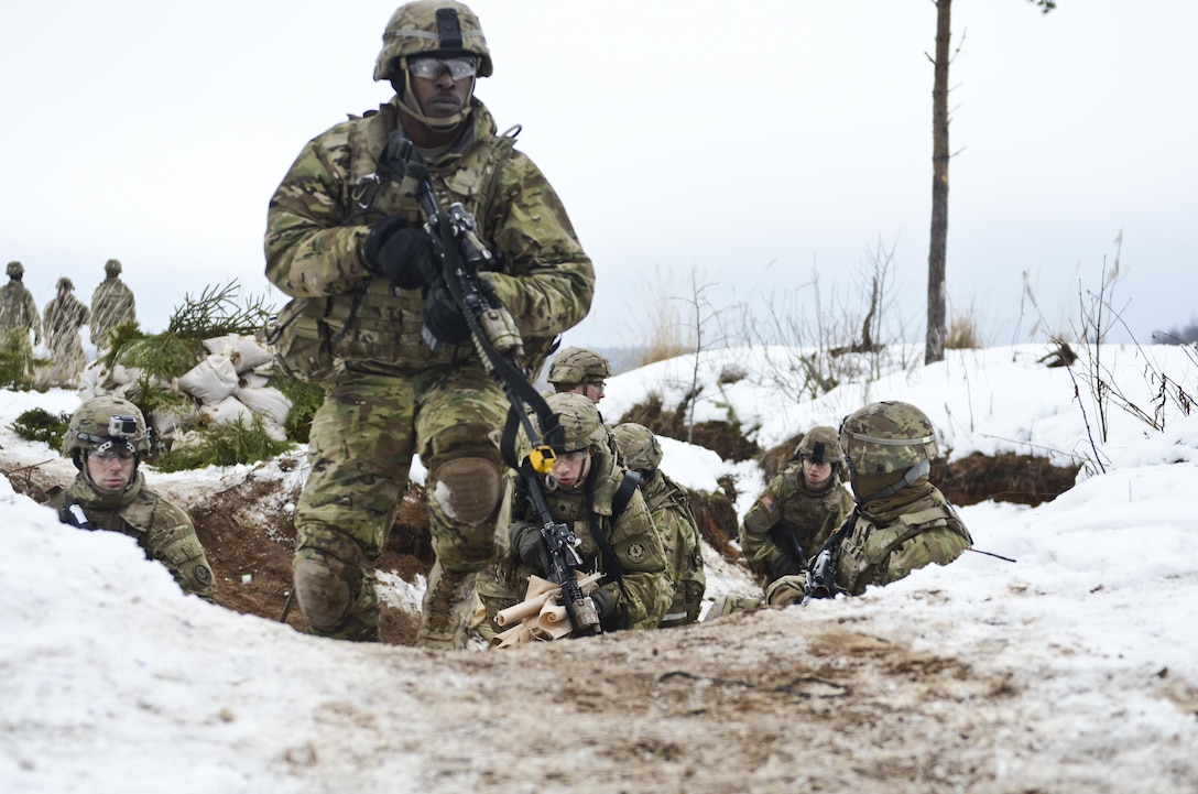Army Spc. Deantray Taylor, foreground, provides forward security for the defense improvement team during a live-fire exercise at Tapa Training Area in Estonia, March 12, 2016. Taylor is an infantryman assigned to the 3rd Squadron, 2nd Cavalry Regiment. Army photo by Staff Sgt. Steven M. Colvin