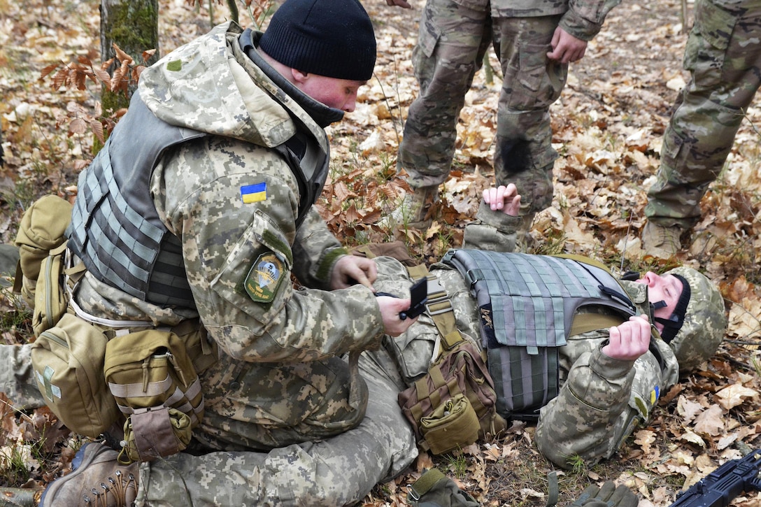 A Ukrainian soldier practices applying a tourniquet on a U.S. soldier during medical training at the International Peacekeeping and Security Center near Yavoriv, Ukraine, March 4, 2016. The U.S. soldier is assigned to the 3rd Infantry Division’s 3rd Battalion, 15th Infantry Regiment, 2nd Infantry Brigade Combat Team. Army photo by Staff Sgt. Adriana M. Diaz-Brown
