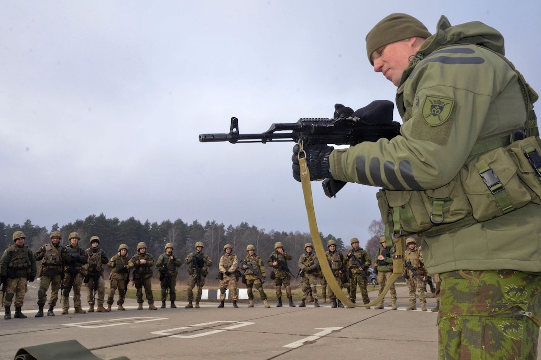 A Lithuanian soldier gives a class to U.S. soldiers on proper weapons handling techniques at the International Peacekeeping and Security Center near Yavoriv, Ukraine, March 5, 2016. Army photo by Staff Sgt. Adriana M. Diaz-Brown