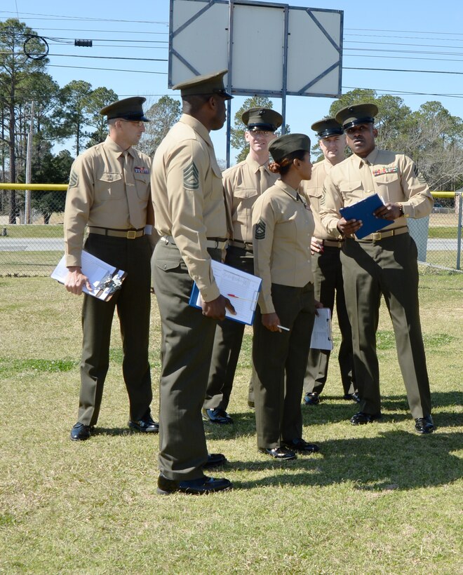 Marines from the base prepare to examine more than 140 Westover High School Marine Corps Junior Reserve Officer Training Cadets during an annual inspection at the school recently.