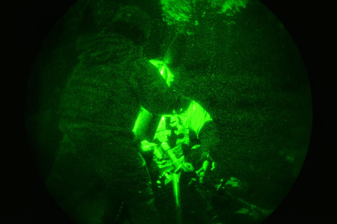 As seen through a night-vision device, Army mortarmen prepare a 120 mm mortar system during a live-fire exercise as part of Exercise Rock Sokol at Pocek Range in Postojna, Slovenia, March 10, 2016. Army photo by Davide Dalla Massara