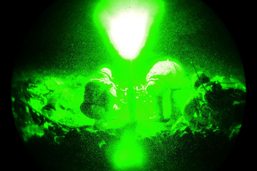 As seen through a night-vision device, Army mortarmen fire a 252A1 81 mm mortar system during a live-fire exercise as part of Exercise Rock Sokol at Pocek Range in Postojna, Slovenia, March 10, 2016. Army photo by Davide Dalla Massara