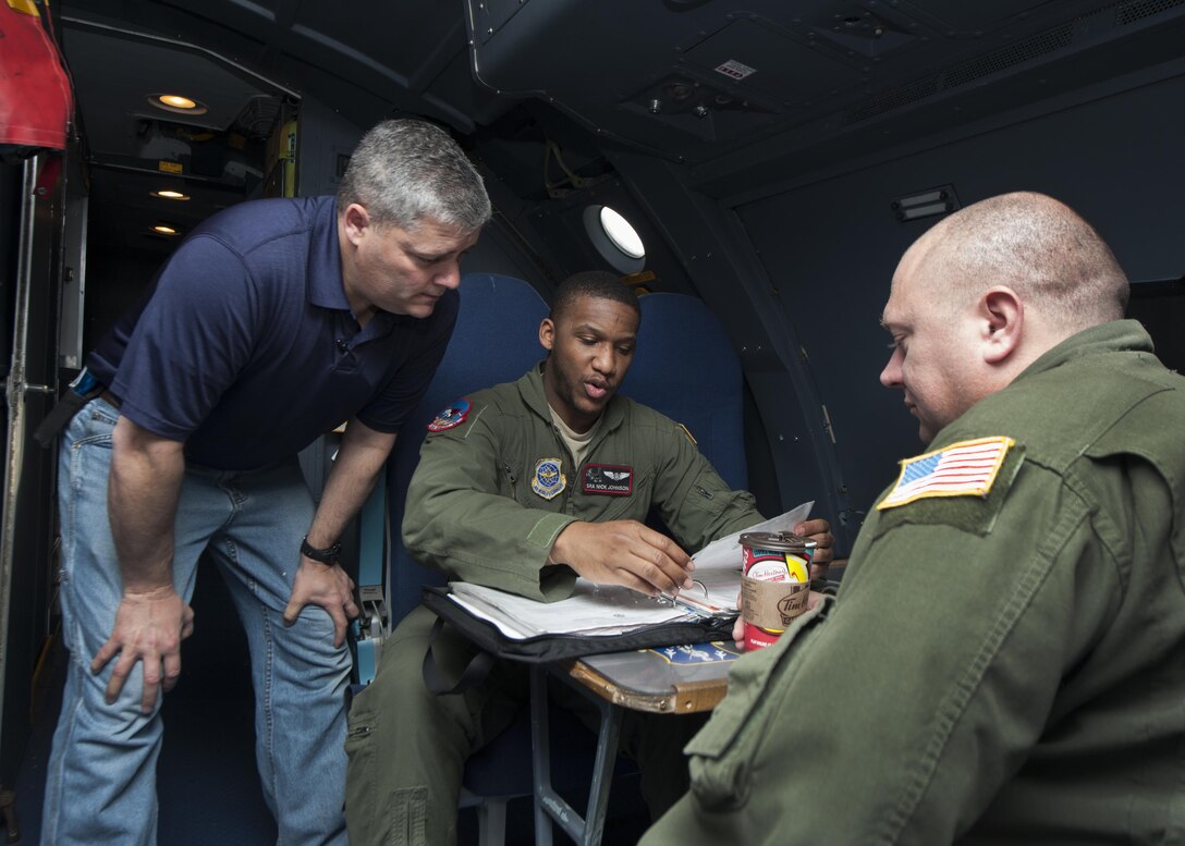 Thomas Lejeune, FlightSafety flight engineer instructor, takes Senior Airman Nick Johnson, 22d Airlift Squadron flight engineer, and Tech. Sgt. Chris Morris, 9th AS flight engineer, through C-5M Super Galaxy pre-flight procedures March 10, 2016, on Dover Air Force Base, Del. In addition to classroom instruction, flight engineer students receive in-depth ground training with the aircraft. (U.S. Air Force photo/Senior Airman Zachary Cacicia)