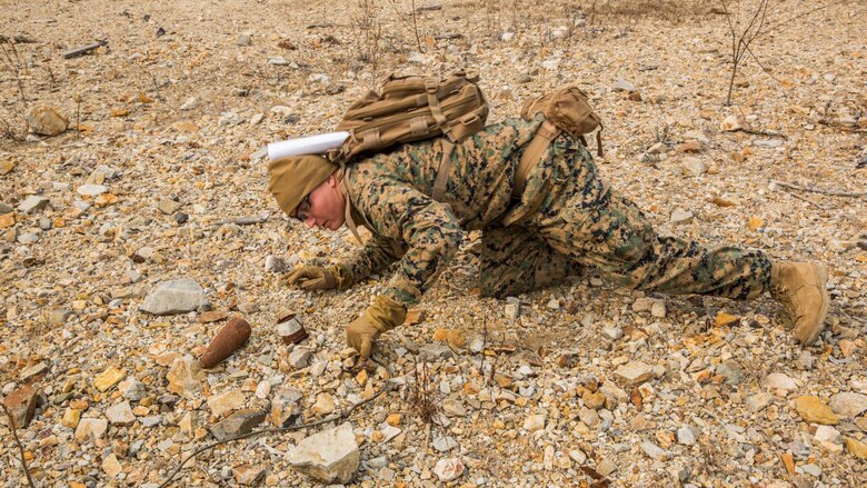 U.S. Marine Staff Sgt. Shaun Reuter, an explosive ordnance disposal technician with the 13th Marine Expeditionary Unit, inspects pieces of an 81 mm round to make sure it doesn’t have any explosives left in it during Exercise Ssang Yong 16 on Suseongri live-fire range, Pohang, South Korea, March 13, 2016. Ssang Yong is a biennial combined amphibious exercise conducted by U.S. forces with the Republic of Korea Navy and Marine Corps, Australian Army and Royal New Zealand Army Forces in order to strengthen interoperability and working relationships across a wide range of military operations.