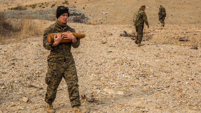 U.S. Marine Sgt. Michael Baker, an explosive ordnance disposal technician with the 13th Marine Expeditionary Unit, carries an undetonated 155 mm round to a consolidation point during Exercise Ssang Yong 16 on Suseongri live-fire range, Pohang, South Korea, March 13, 2016. Ssang Yong is a biennial combined amphibious exercise conducted by U.S. forces with the Republic of Korea Navy and Marine Corps, Australian Army and Royal New Zealand Army Forces in order to strengthen interoperability and working relationships across a wide range of military operations.